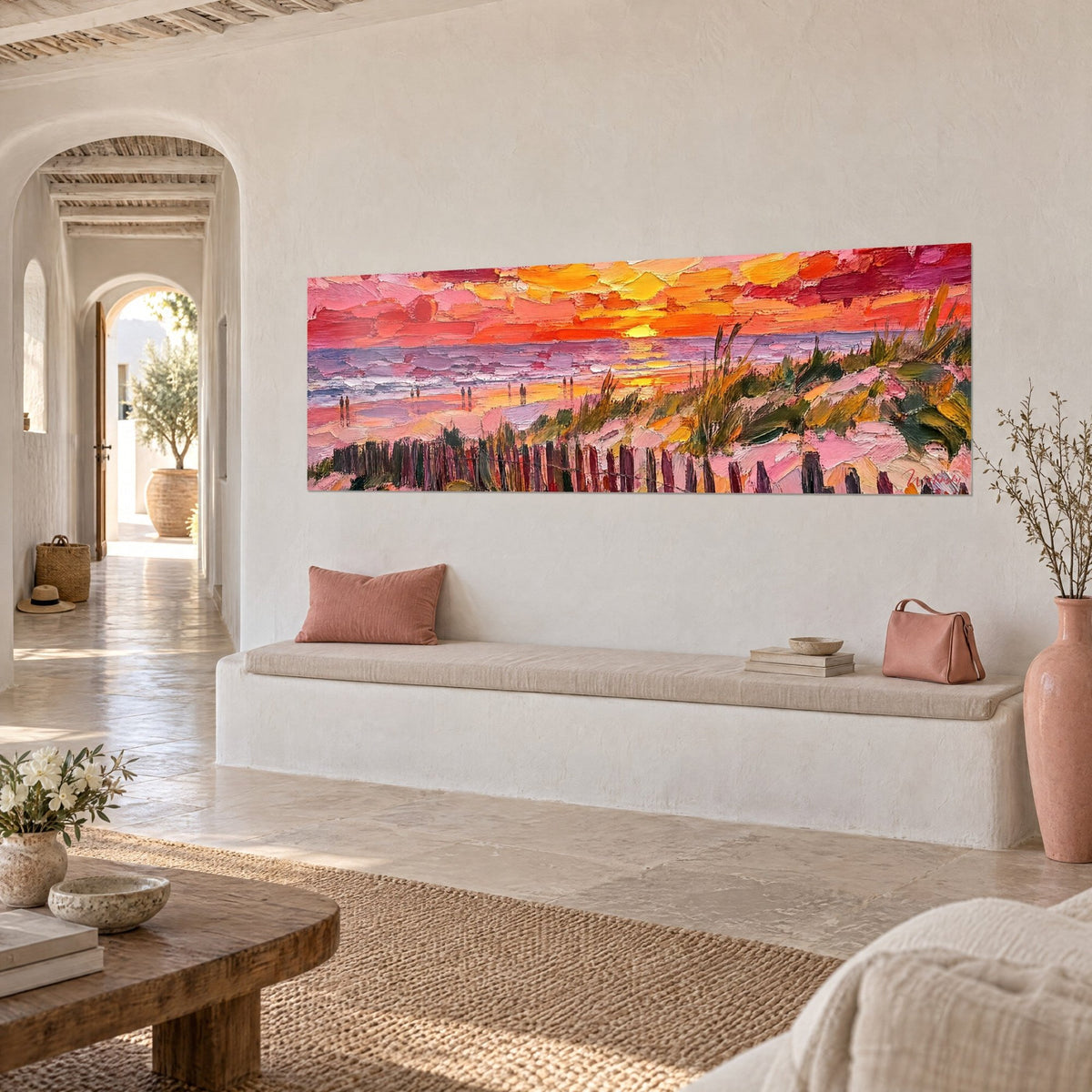 Wall art of a beach at sunset, yellow sun over a lilac and pink sea, three-quarter view in a Mediterranean home