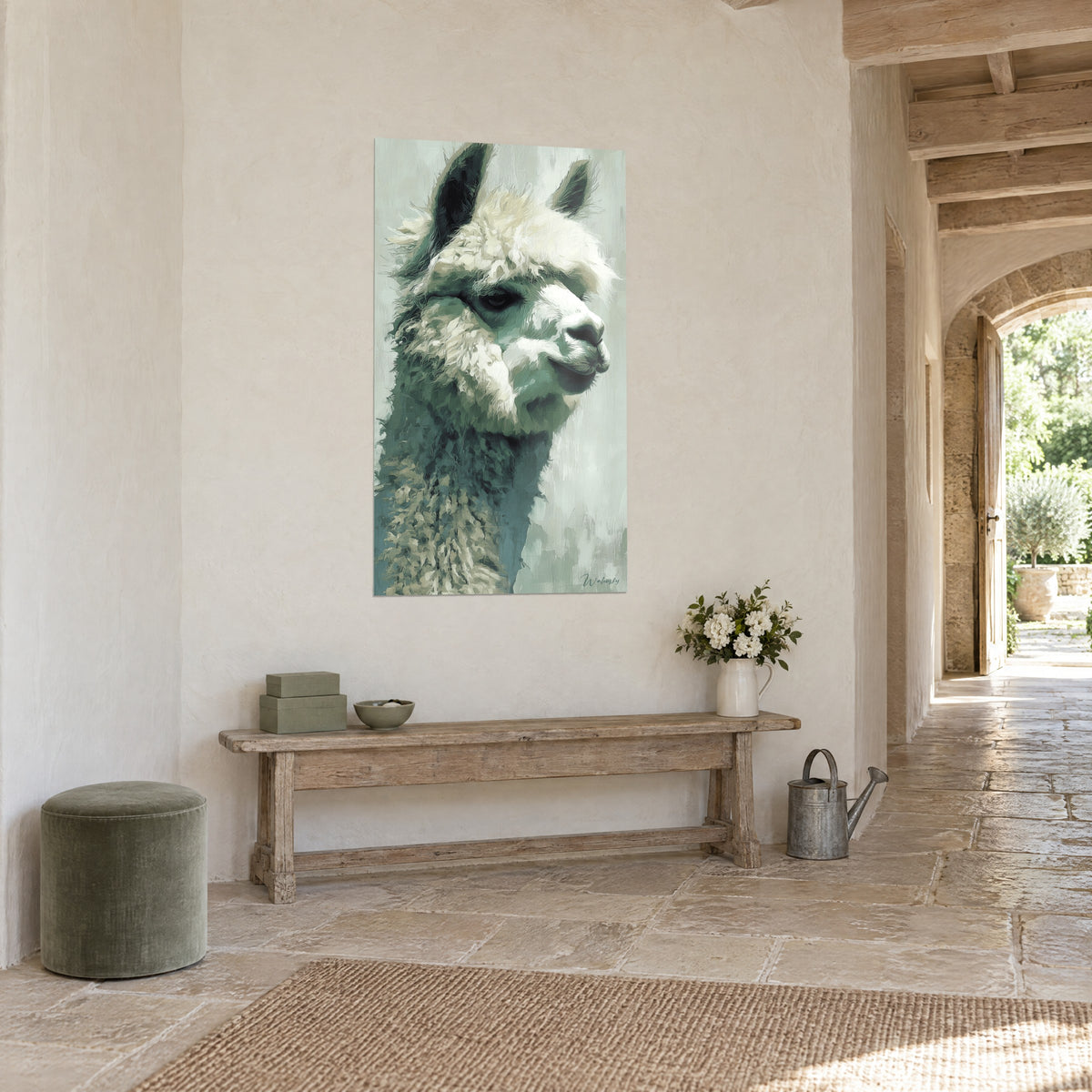 Wall art camelid with a white muzzle and verdigris neck, placed on a beige wall beside a sunlit stone archway