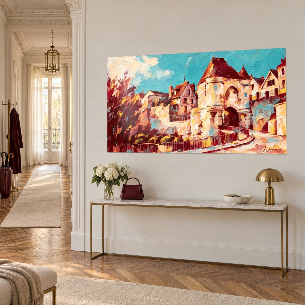 Quadro mura medievali in pietra color crema e tetti bordeaux, vicolo tortuoso in primo piano, su una parete beige con console dorata
