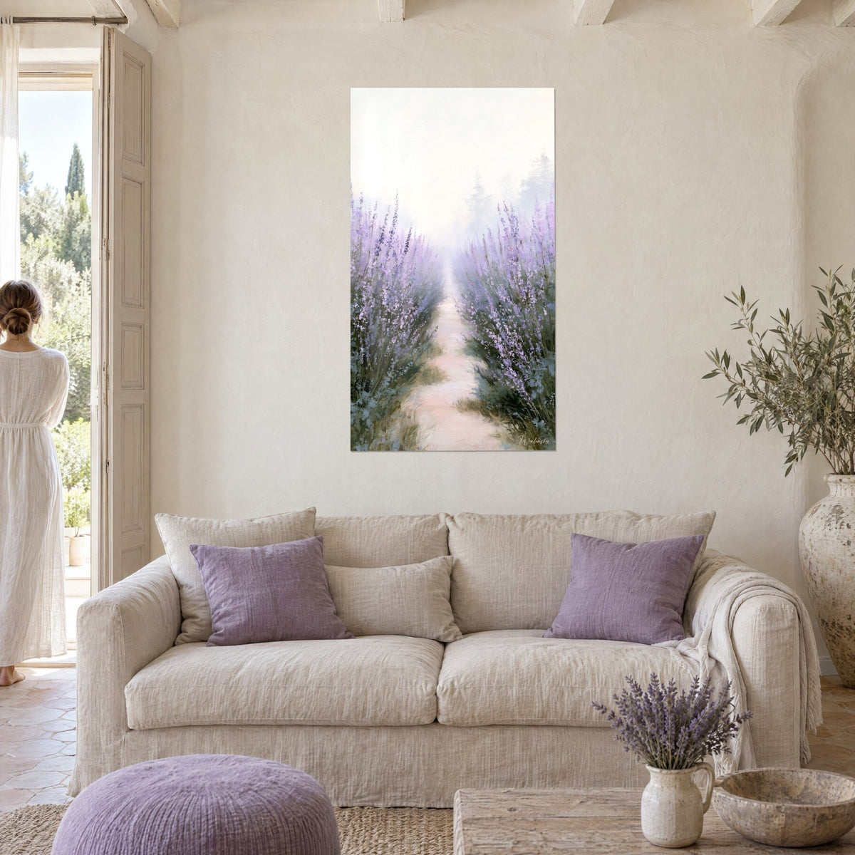 Wall art rosy sand path between rows of mauve lavender in the mist, above a sofa in a bright living room