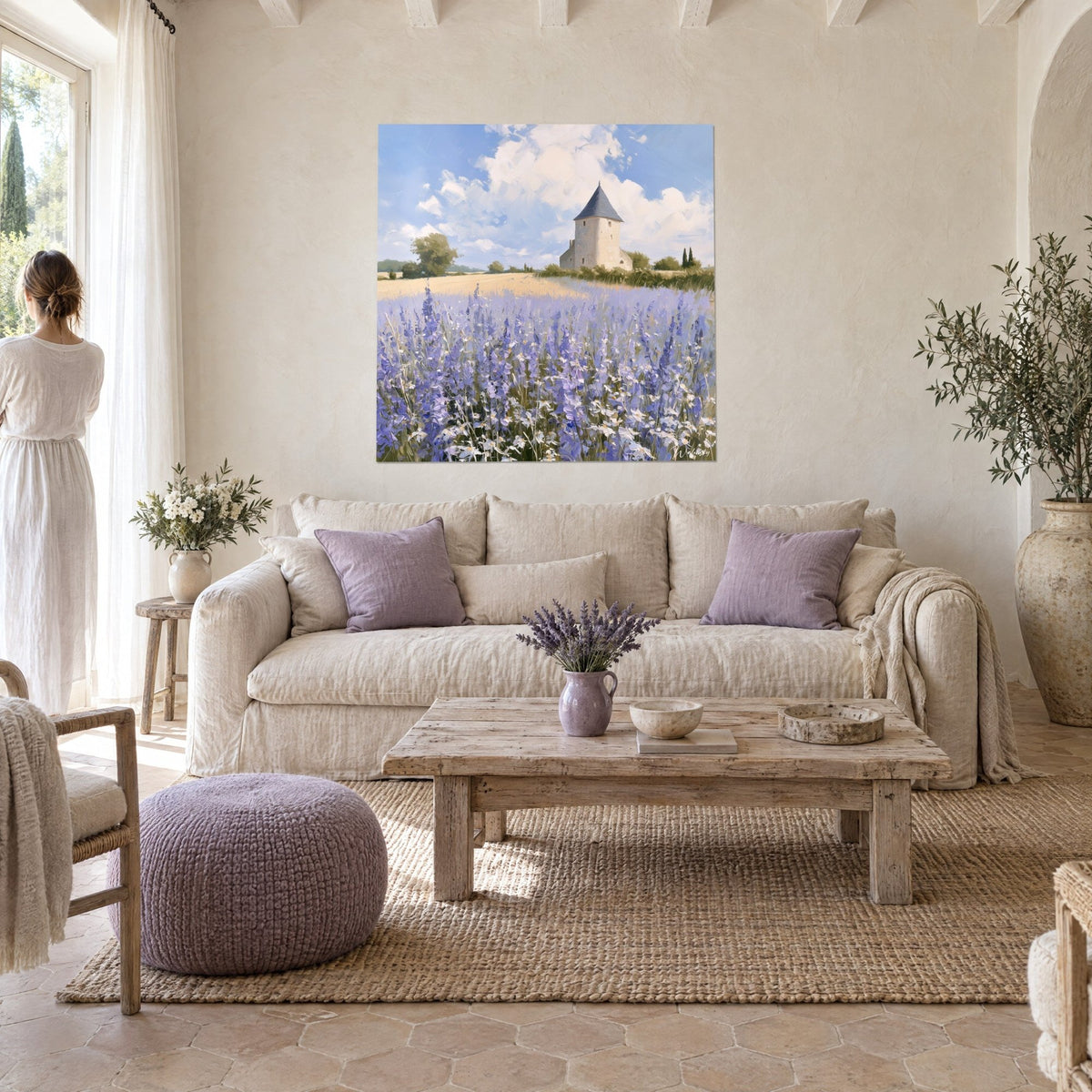 Wall art beige stone tower with grey slate roof, purple lavender field, blue sky, above a sofa in a bright living room