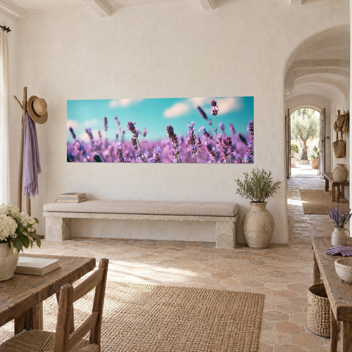 Wall art lavender field in bloom, green stems and blue-green sky, hung on a pale stone wall of a Provençal farmhouse