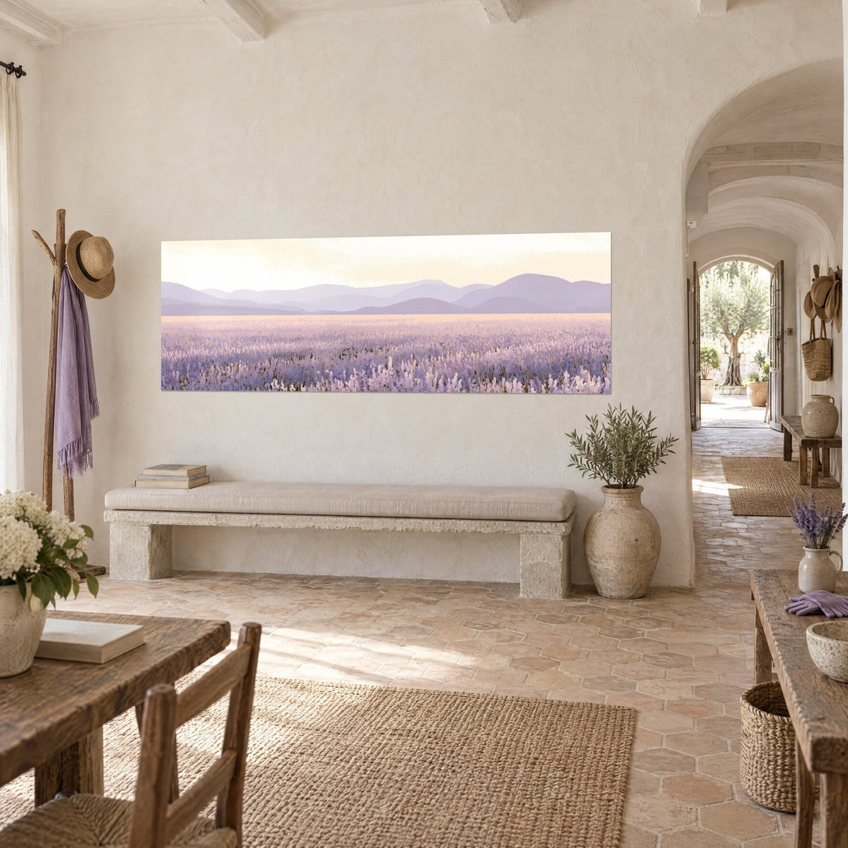 Wall art row of lilac flowers and misty grey hills, hung on a limewashed wall, three-quarter view in a Provençal farmhouse