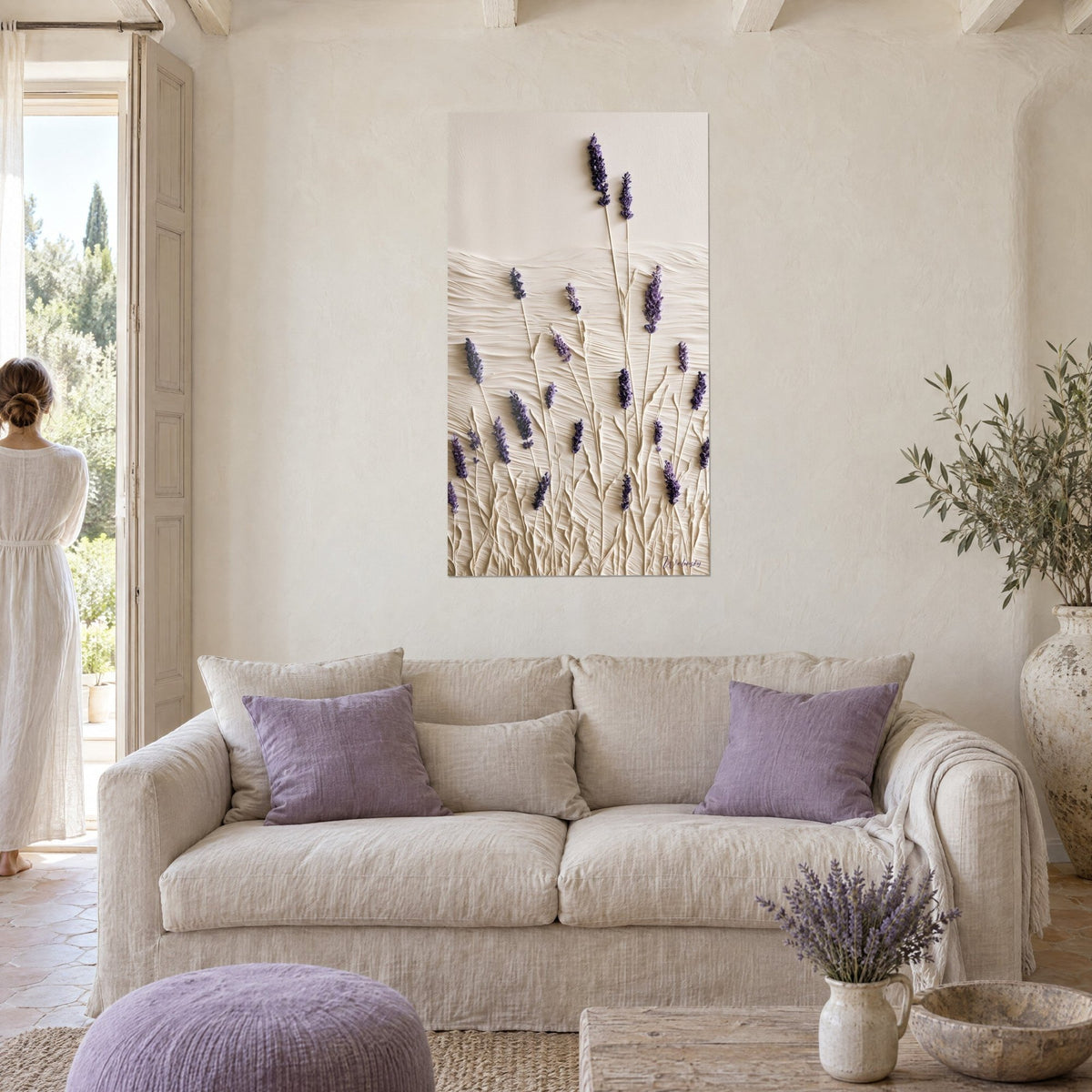 Wall art with purple lavender spikes and ivory raised stems, hung above a sofa in a bright living room