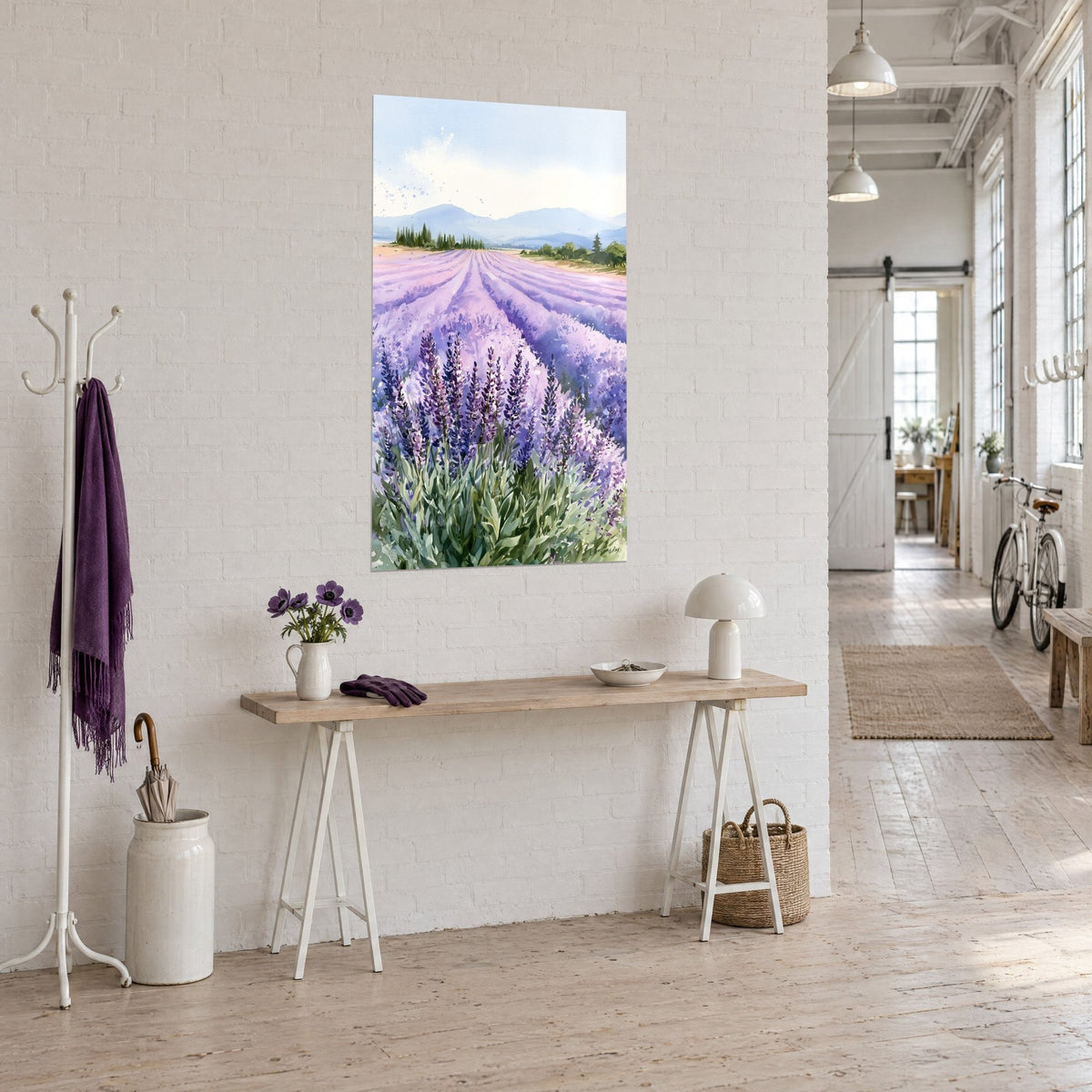 Wall art violet rows fading toward bluish mountains, pale sky, hung above a wooden console in a loft