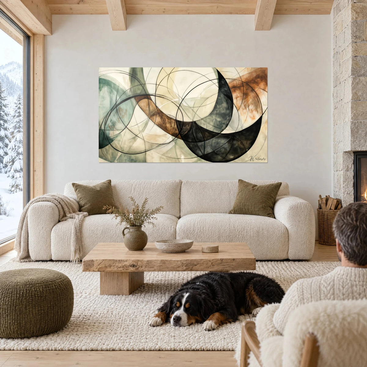 Wall art interlocking circles in sage green and burnt copper brown, black crescent, above a sofa in a bright living room