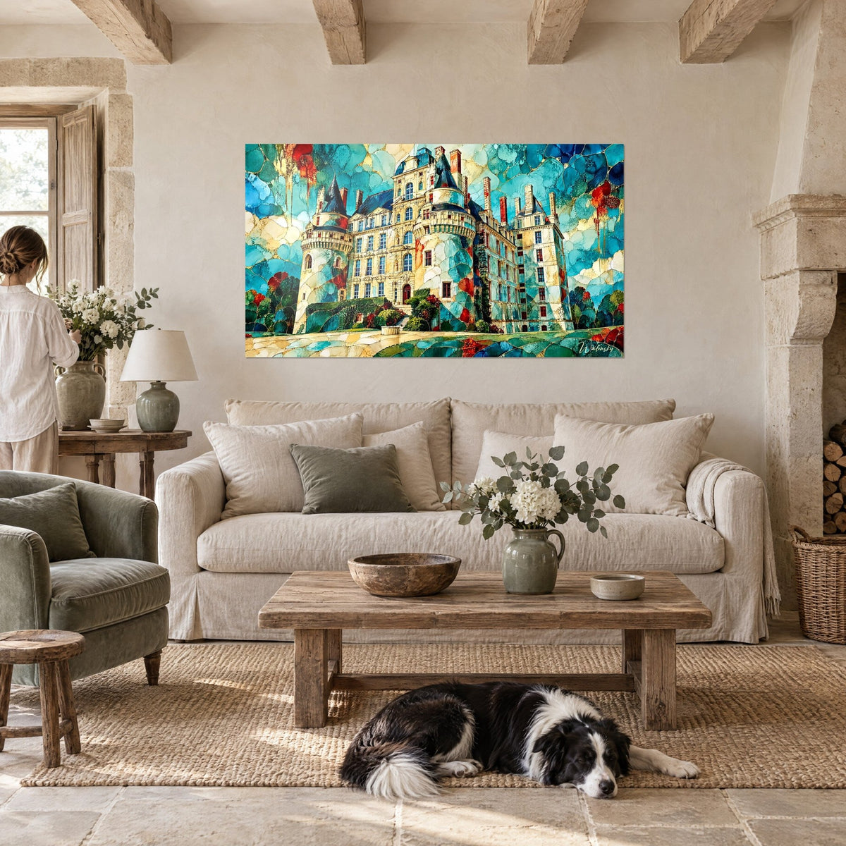 Wall art Loire castle with turquoise and gold turrets, two people and a collie in front, above a sofa in a bright living room