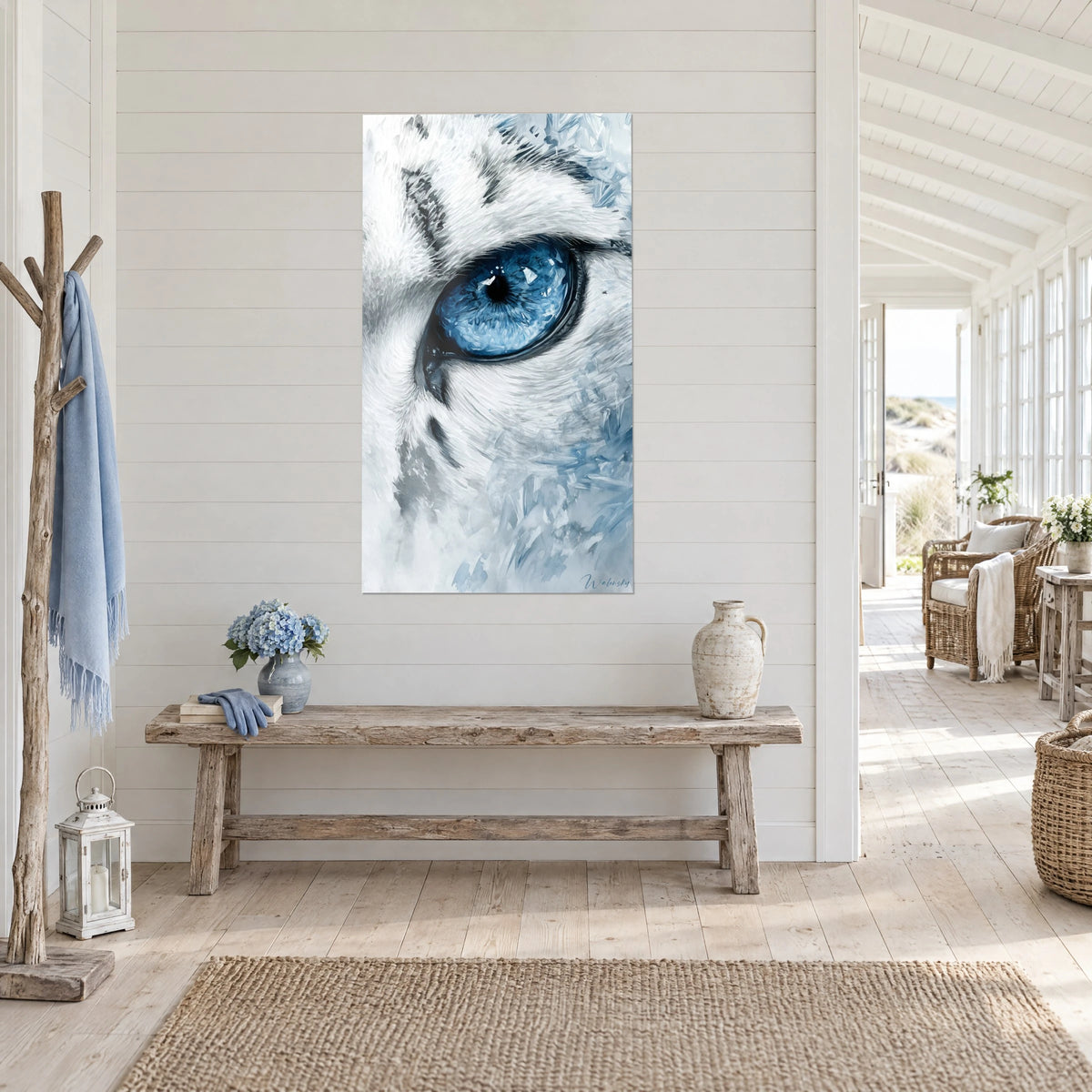 Wall art of a white leopard's gaze, black pupil ringed in azure and frosty fur, in a light wood house entrance