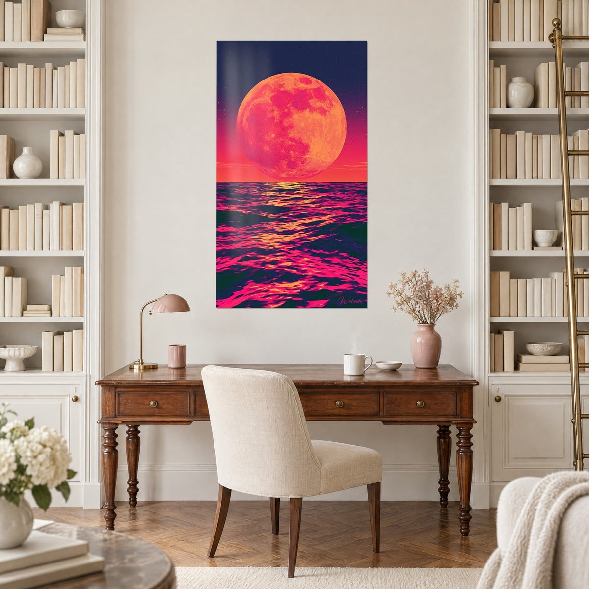 Wall art giant salmon moon over pink waves streaked with gold, indigo sky, above a wooden desk between two bookshelves