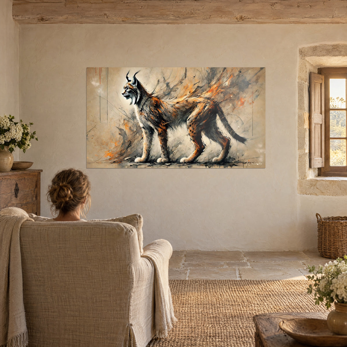 Wall art slender wildcat with a black tail, orange flames and grey wash, facing a linen armchair in a rustic living room