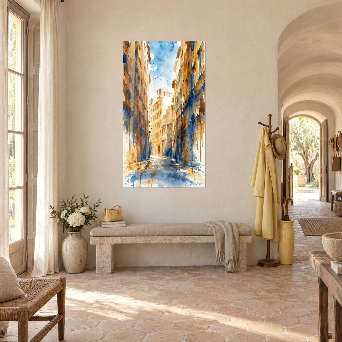 Wall art of a narrow street lined with saffron buildings, washed blue sky and shaded cobblestones, three-quarter view in a Provençal farmhouse