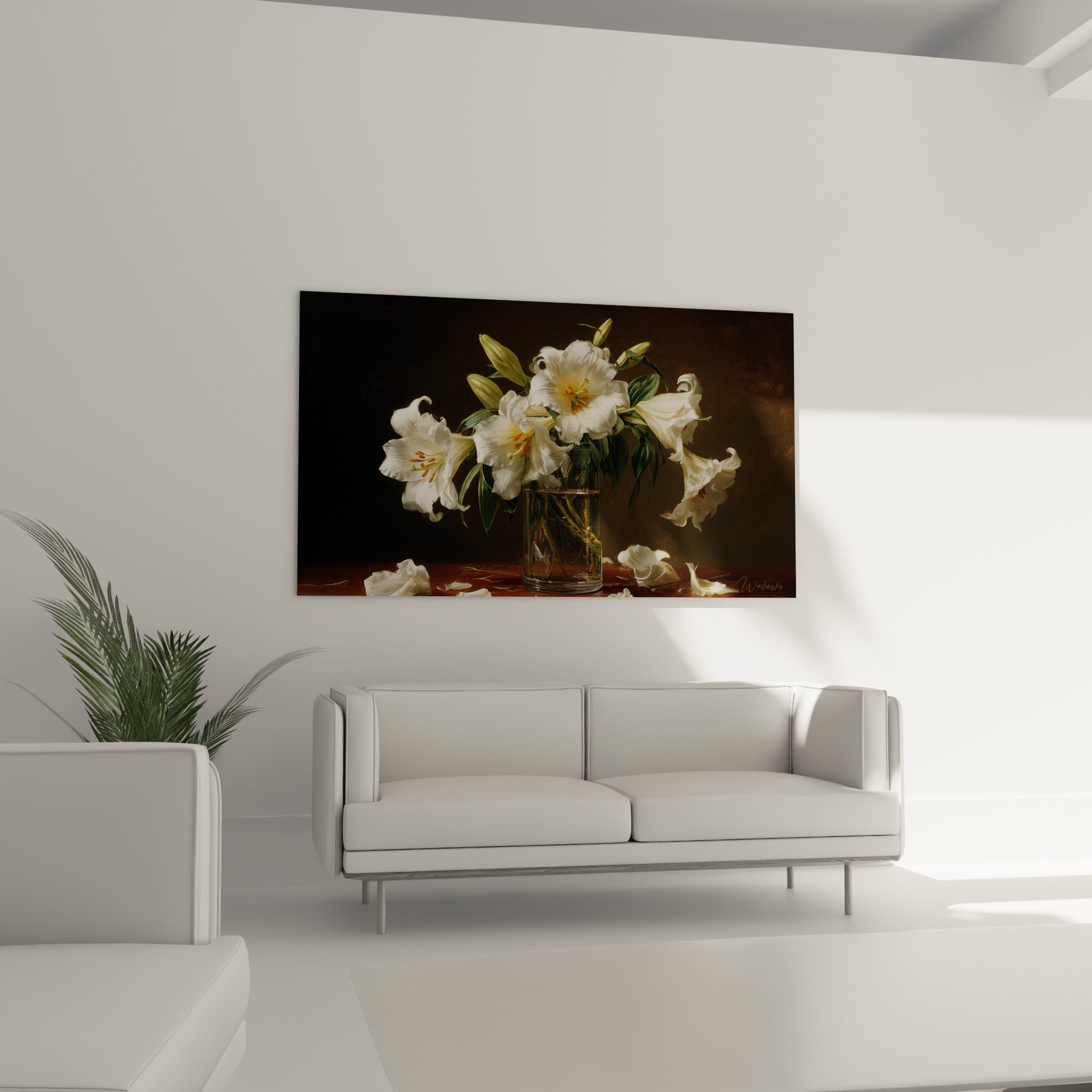 Fleurs de lys blanc et pétales tombés sur une table acajou, disposées au-dessus d'un canapé dans un salon lumineux