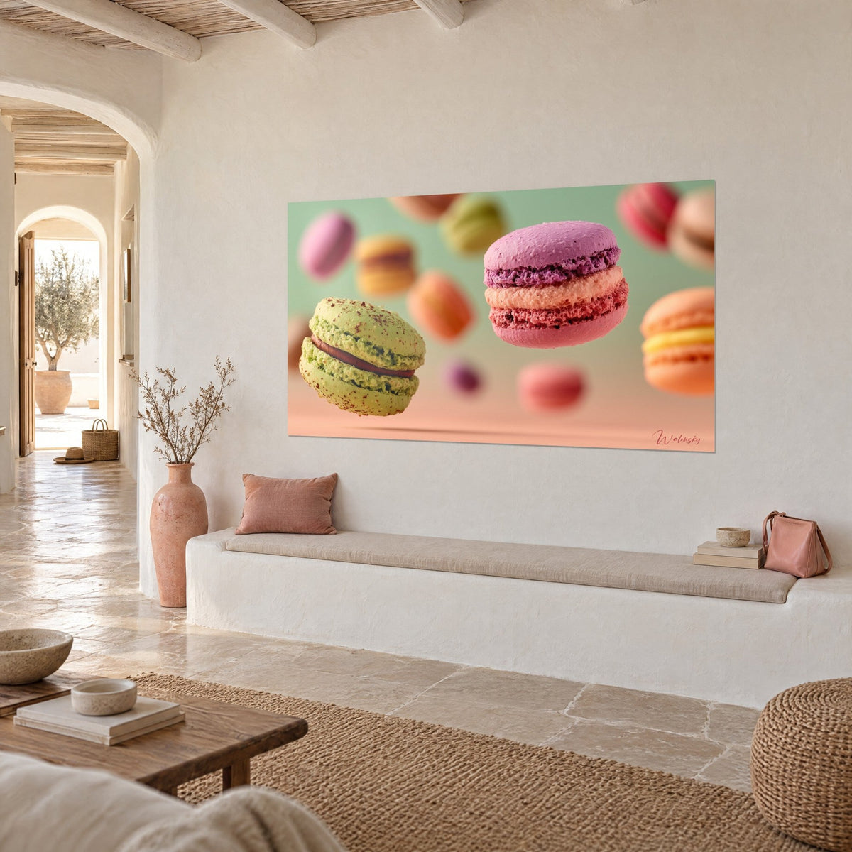 Tableau gourmandises françaises flottantes, coque vert pistache et macaron mauve, cadre sobre sur un mur chaulé, vue de trois-quarts