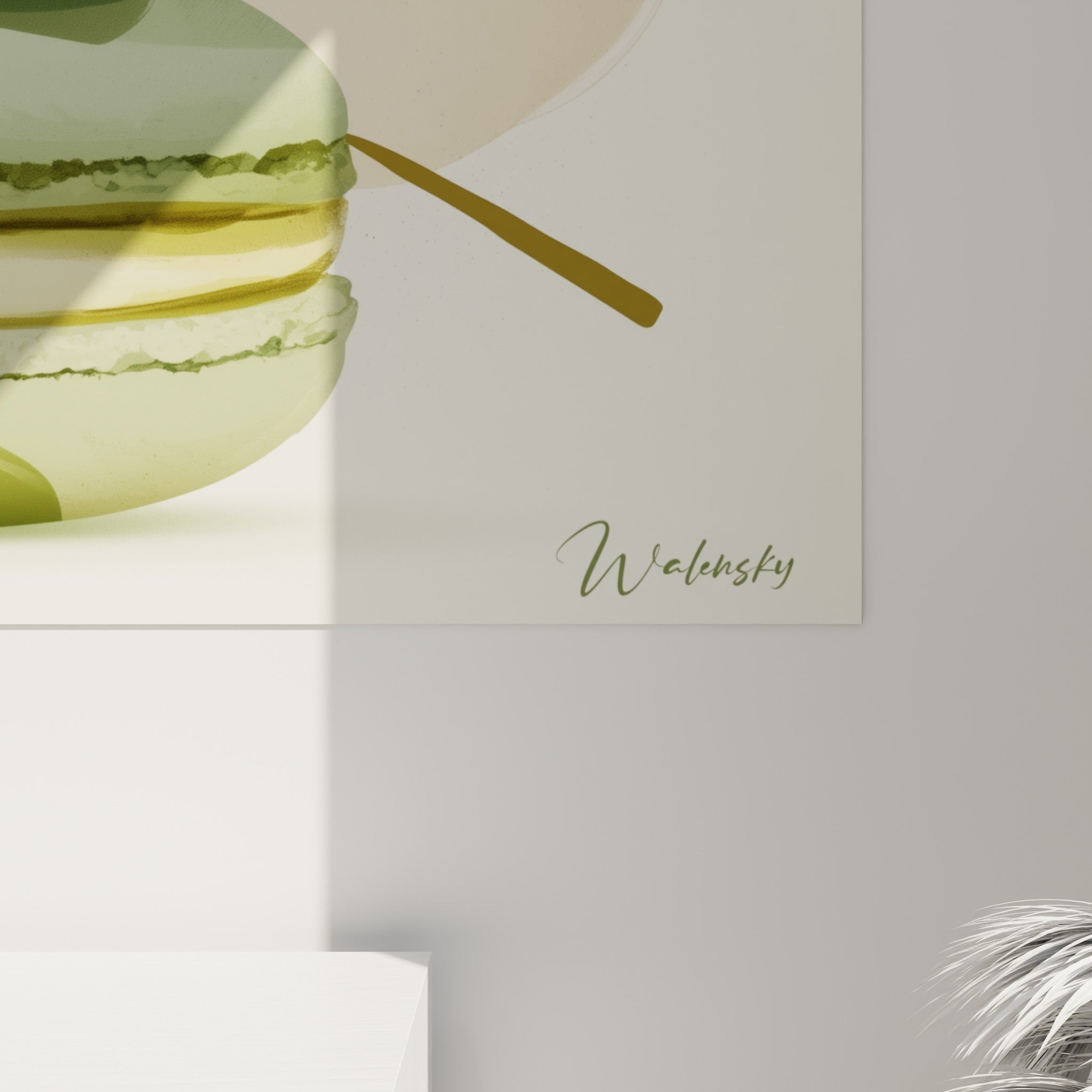 Détail des coques de macarons montrant les touches dorées et les nuances vert sauge et terracotta