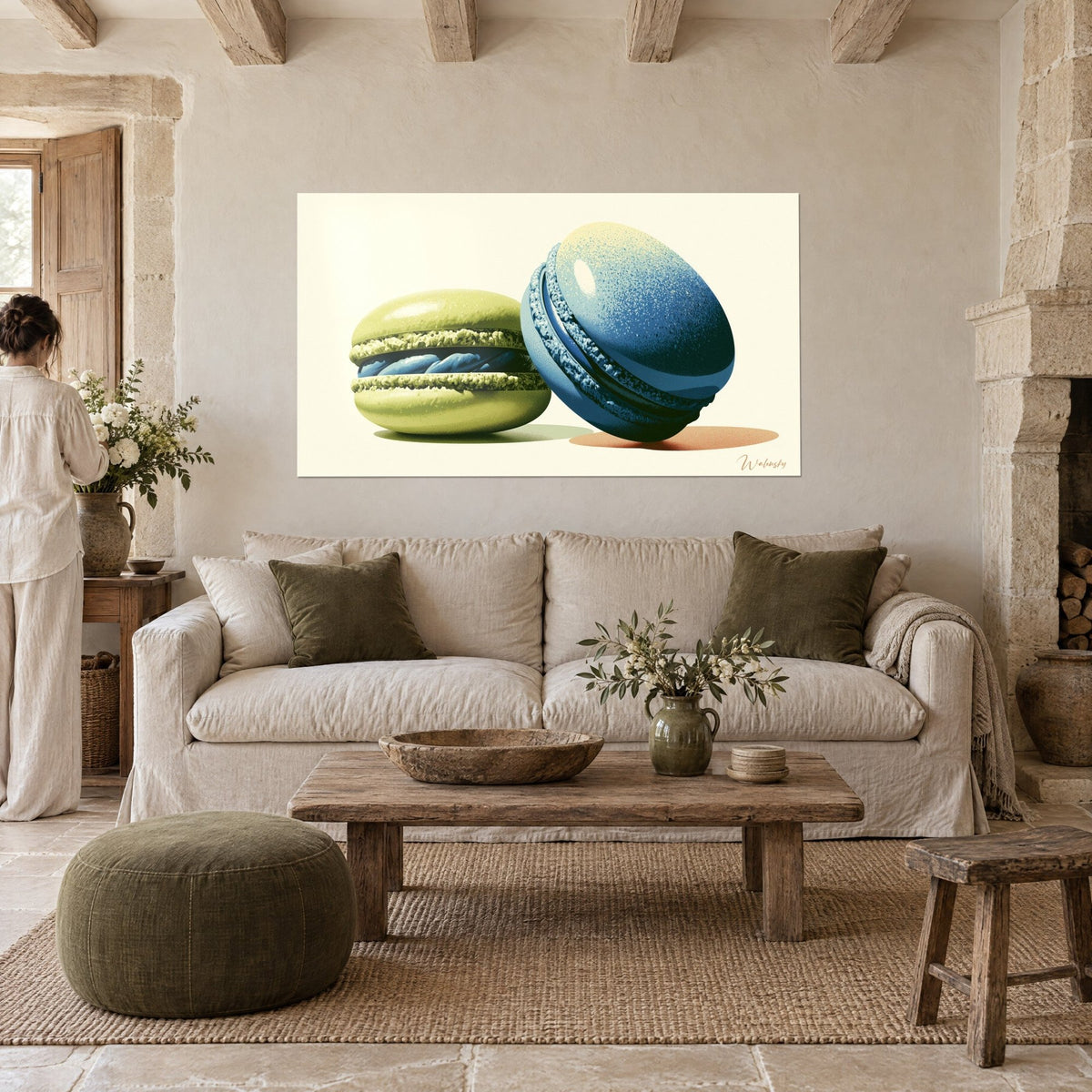 Wall art pistachio macaron beside its navy blue twin, rosy shadow on the floor, hung above a sofa in a bright living room