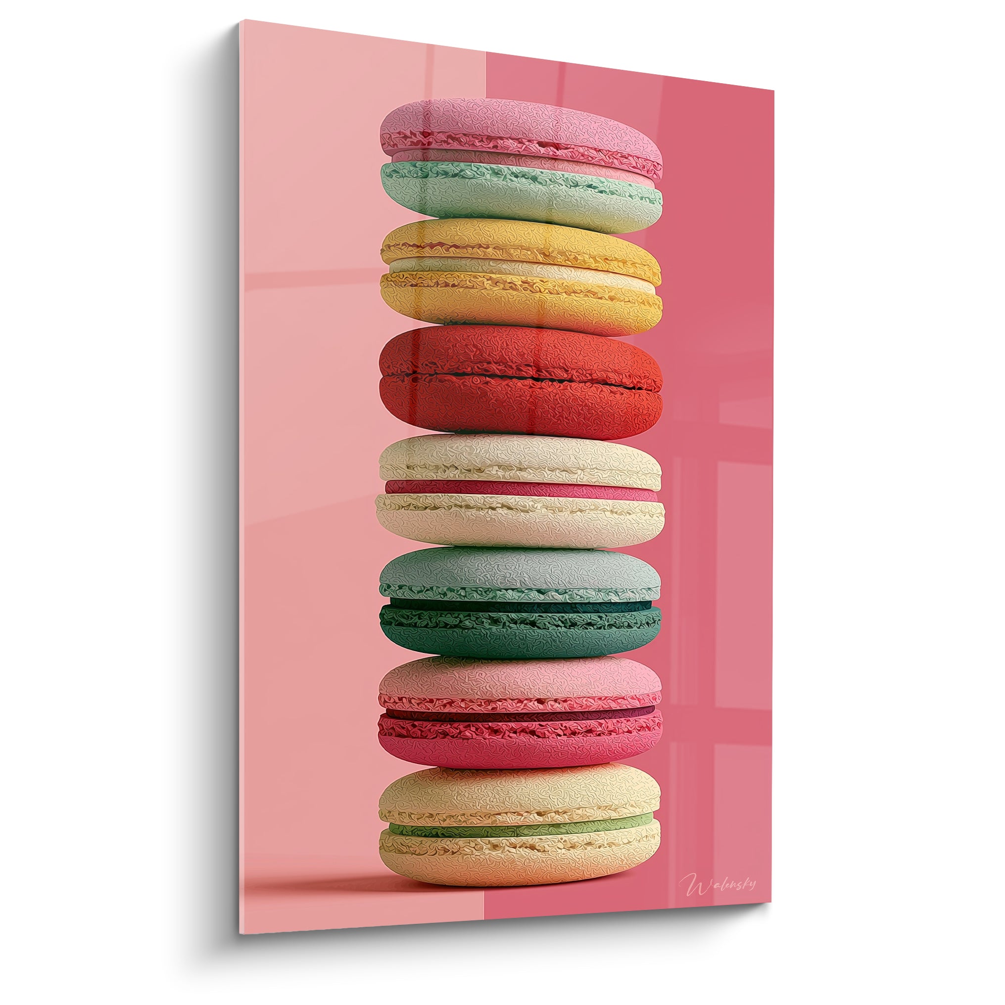Macarons roses, verts et dorés empilés en tour sur fond rose vif éclatant