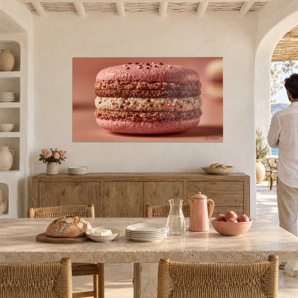 Wall art large macaron with two pale pink and cocoa-brown ganaches, above a wooden sideboard in a dining room