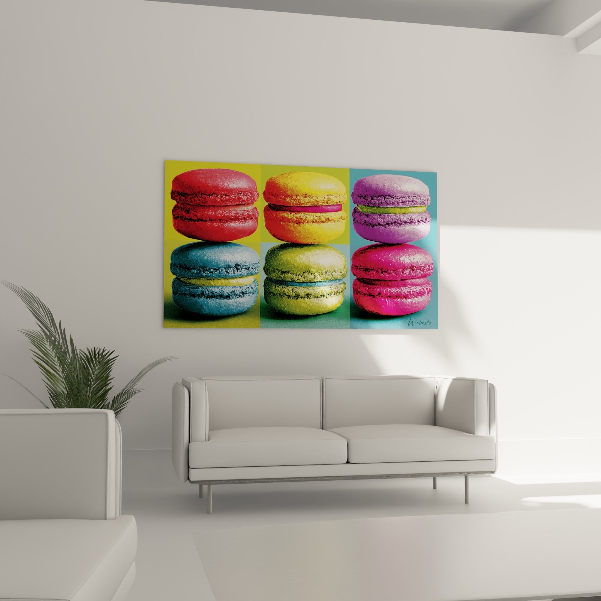 Gourmandises sucrées jaune et vert anis formant un tableau macaron au-dessus d'un canapé dans un salon lumineux