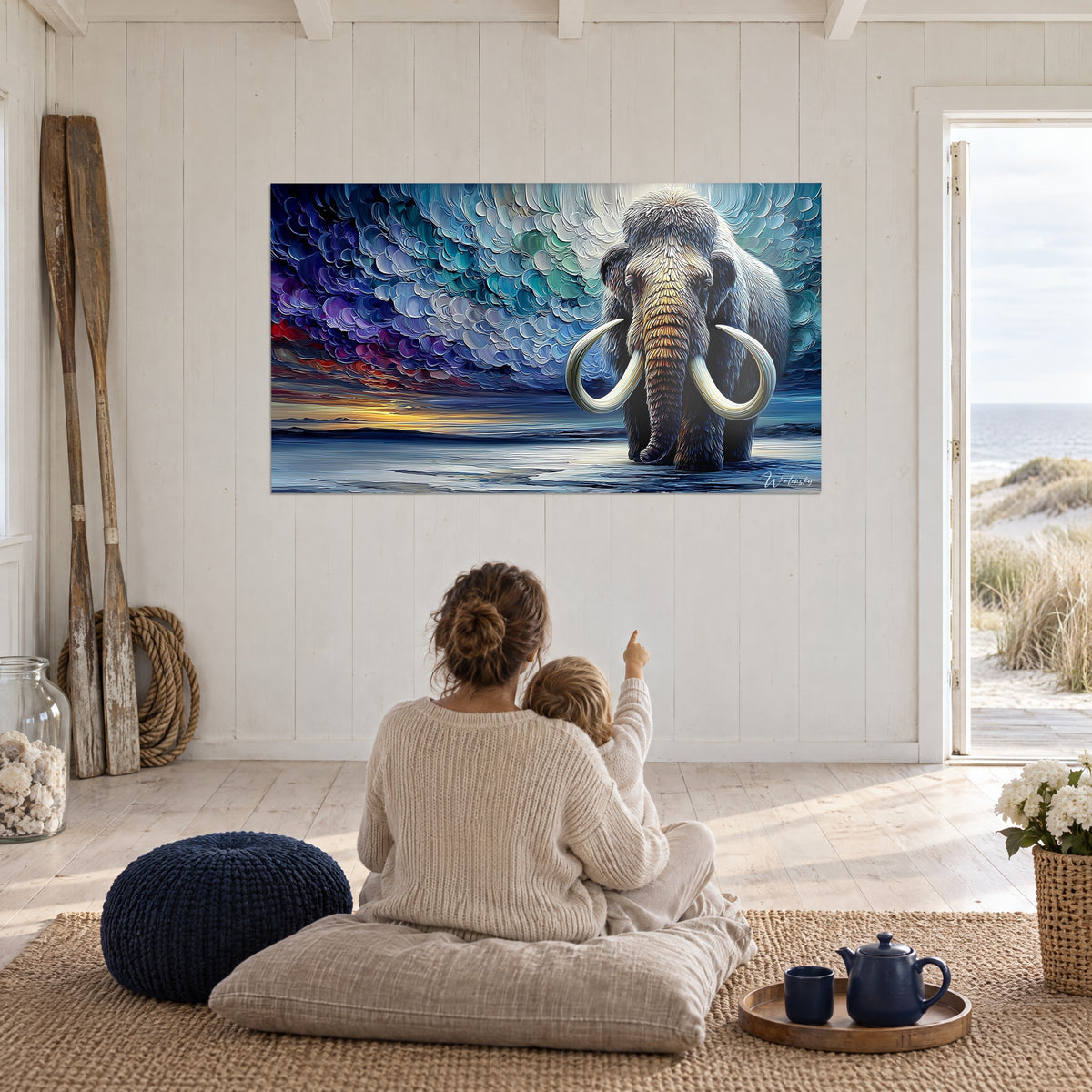 Cuadro mamut y cielo agitado en relieve, azul profundo, naranja en el horizonte, madre e hijo sentados de espaldas sobre un cojín