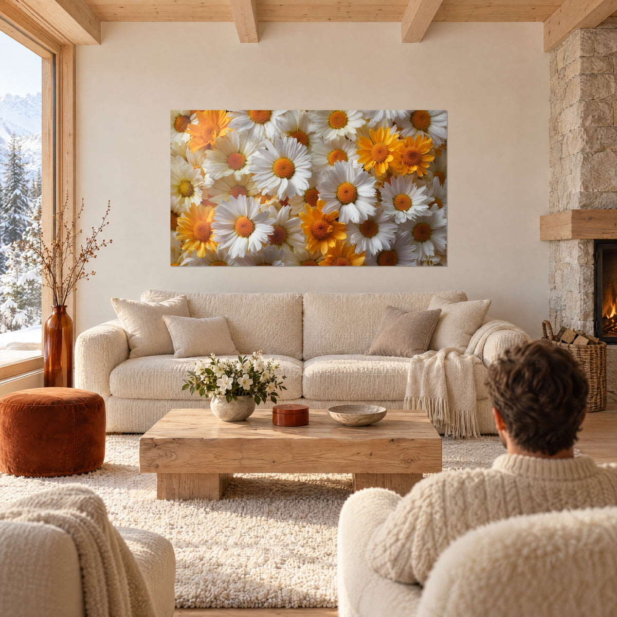 Schilderij tapijt van witte madeliefjes met oranje harten, roze blaadjes, boven een bank in een lichte woonkamer