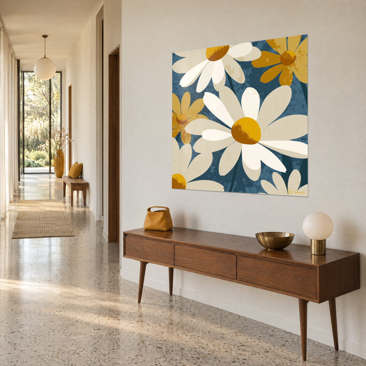 Wall art with giant cream and mustard chamomile flowers on petrol blue background, hung at the end of a hallway, wooden console table
