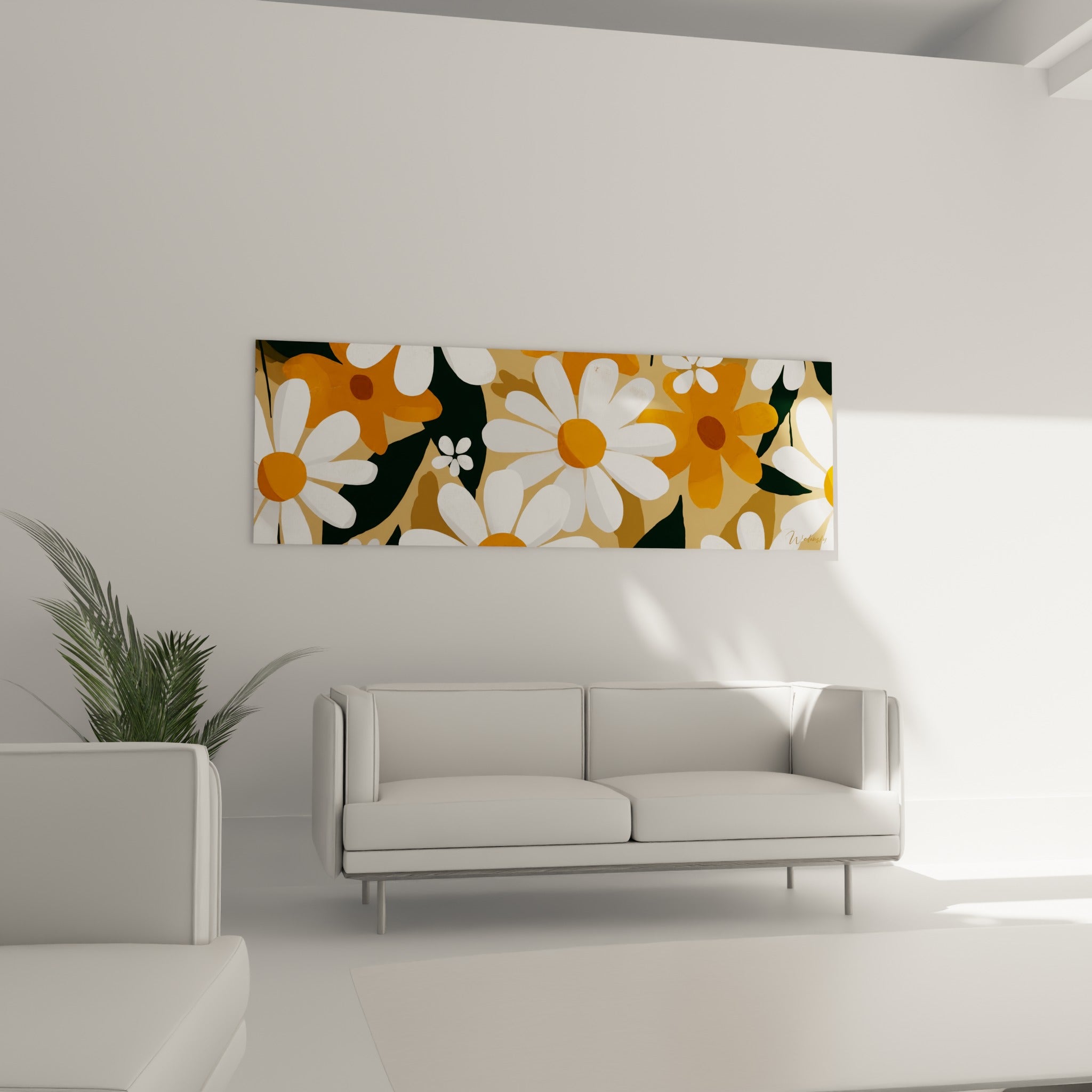 Fleurs blanches aux cœurs orange et feuillage anthracite au-dessus d'un canapé dans un salon lumineux
