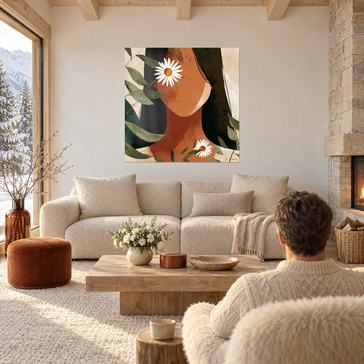 Schilderij van een vrouwelijke silhouet in terracotta met witte madeliefjes, zwart haar, saliegroene bladeren, boven een bank in een lichte woonkamer