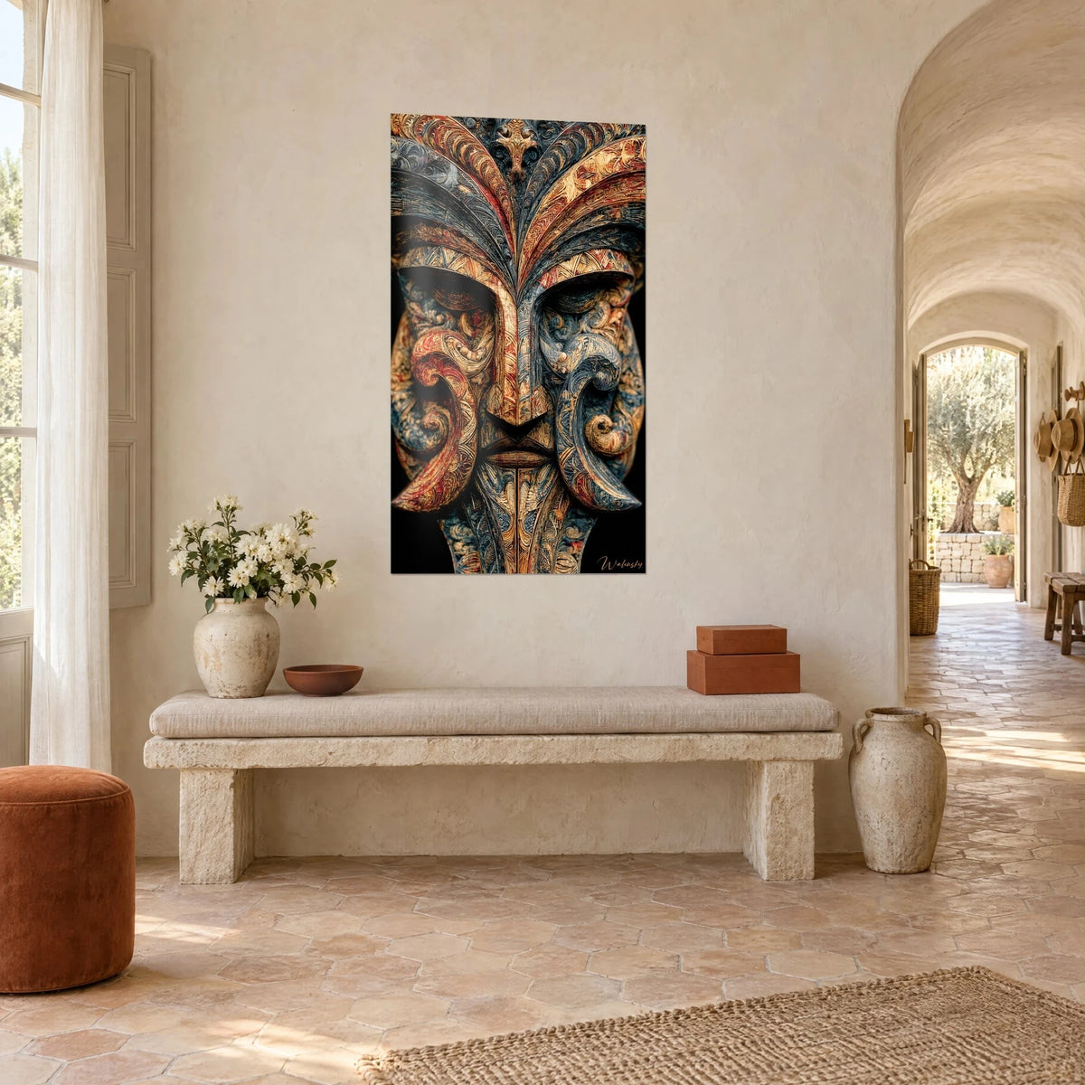 Wall art tribal deity with a stern gaze, ochre and indigo curls on a black background, on a whitewashed wall of a Provençal farmhouse
