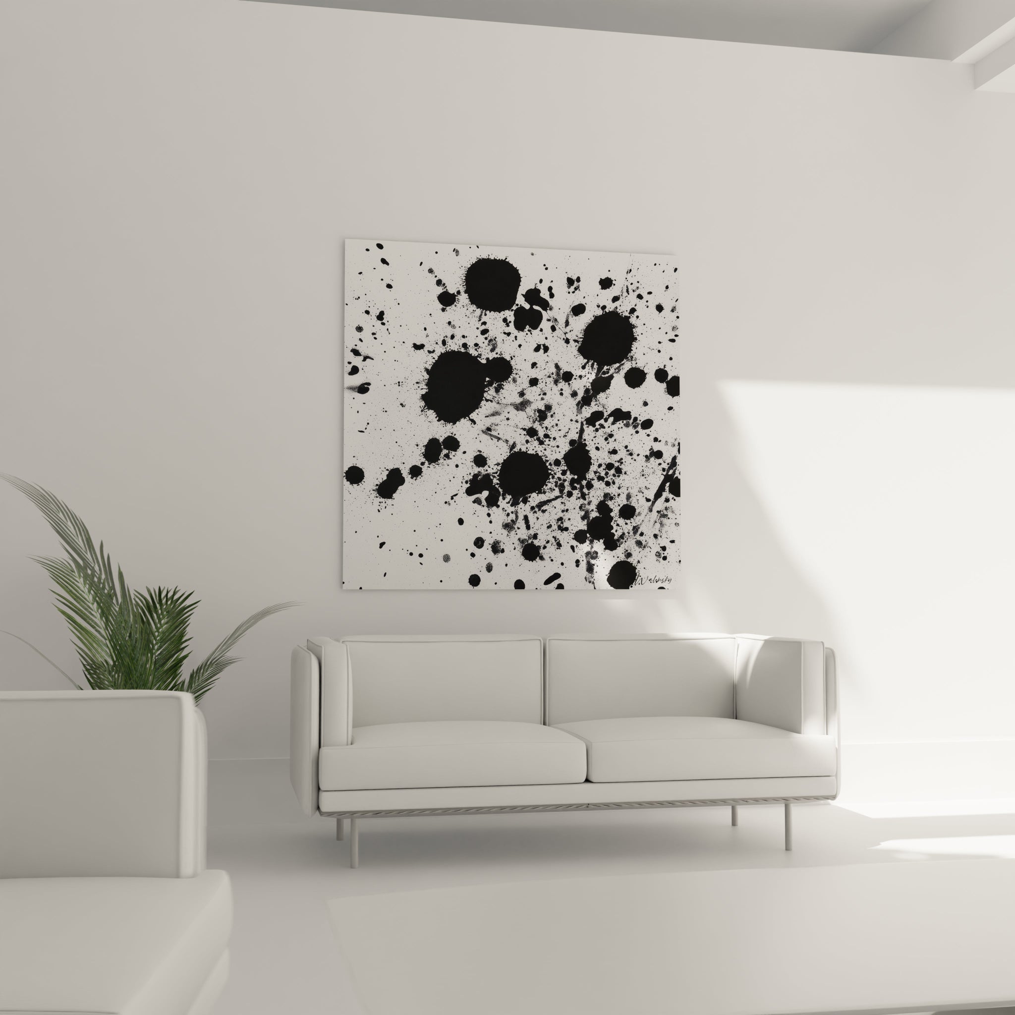Tableau tacheté noir et blanc Walensky accroché au mur d'un salon moderne avec un canapé blanc