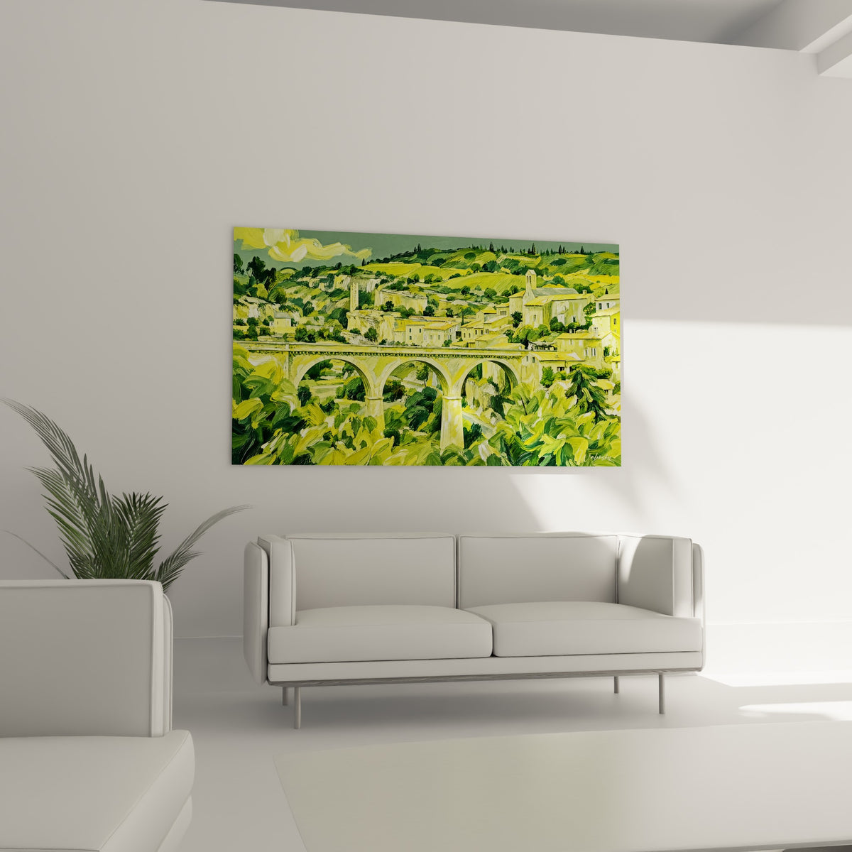 Bourg méridional aux façades jaune pâle et vert olive, au-dessus d'un canapé dans un salon lumineux