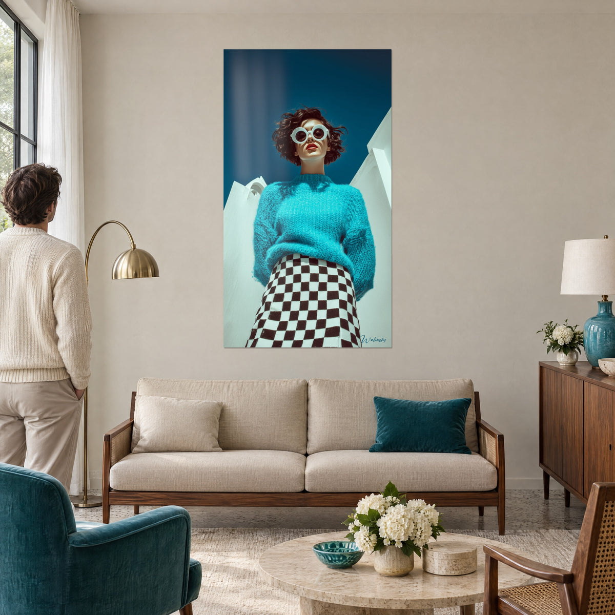 Wall art of a woman with round white glasses, turquoise mohair knit sweater, midnight blue sky, above a sofa in a bright living room