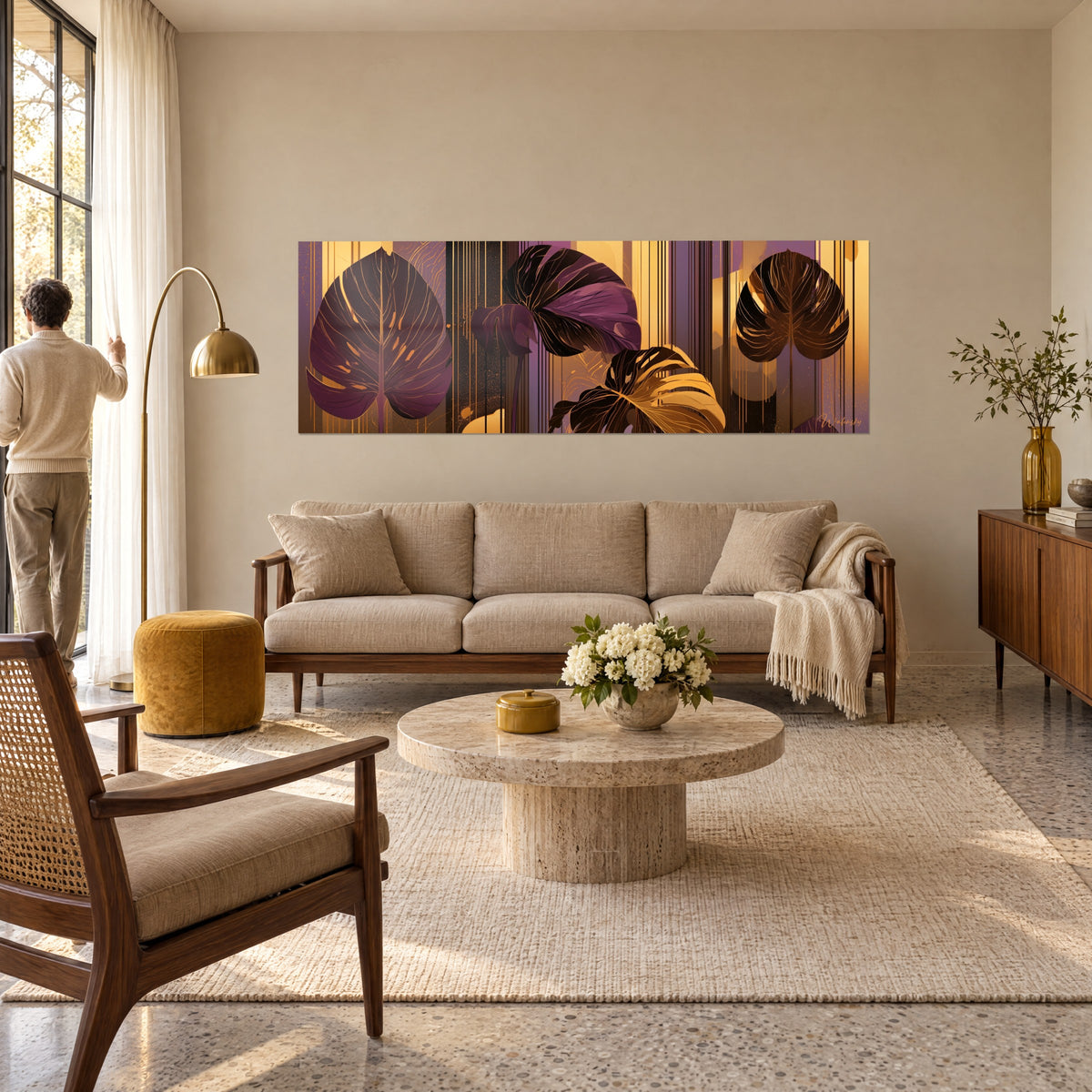 Wall art aubergine monstera with golden veins on ochre striped background, a man seen from behind above a sofa in a bright living room