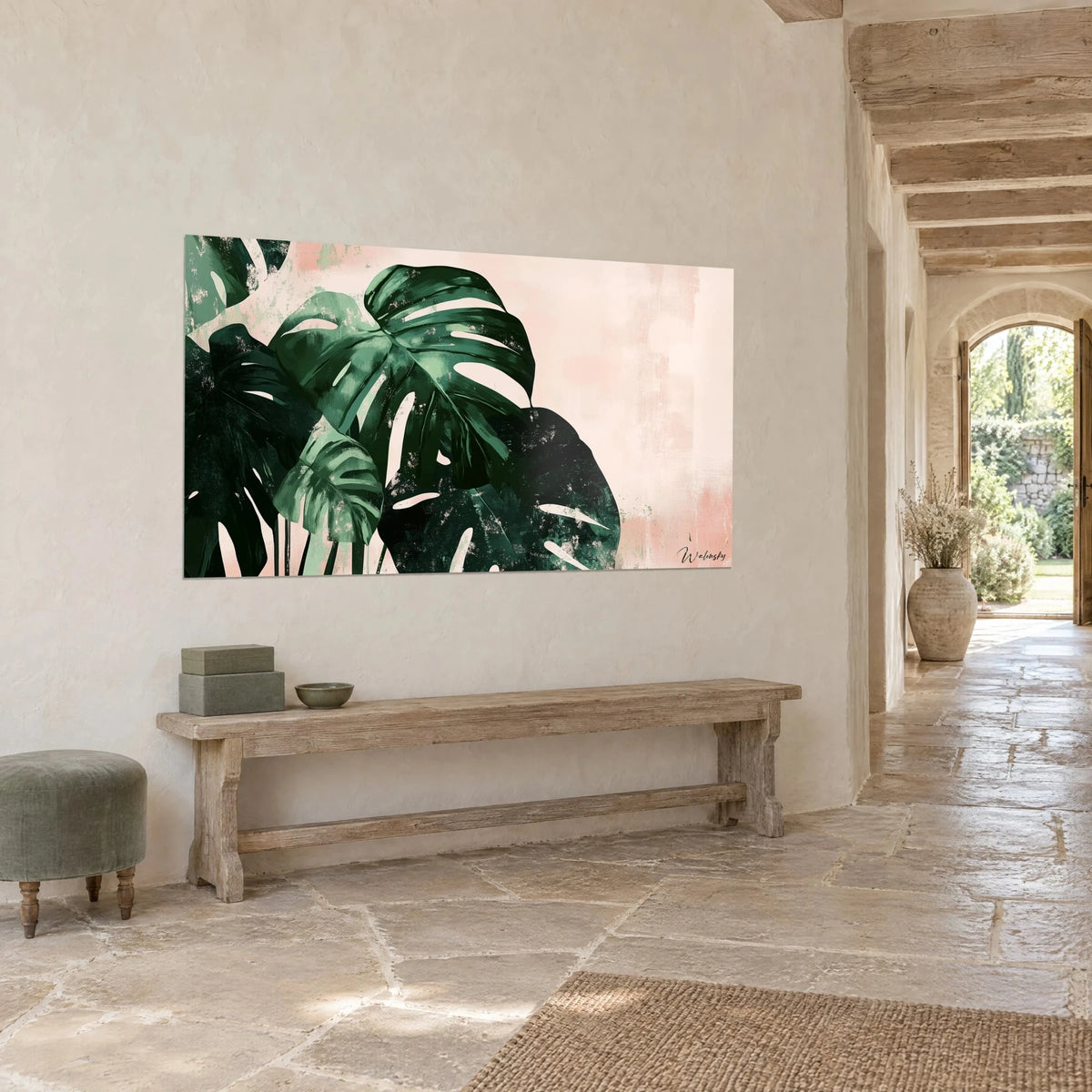 Wall art of shredded philodendron leaves in deep green and pale pink, facing a stone corridor and its arch