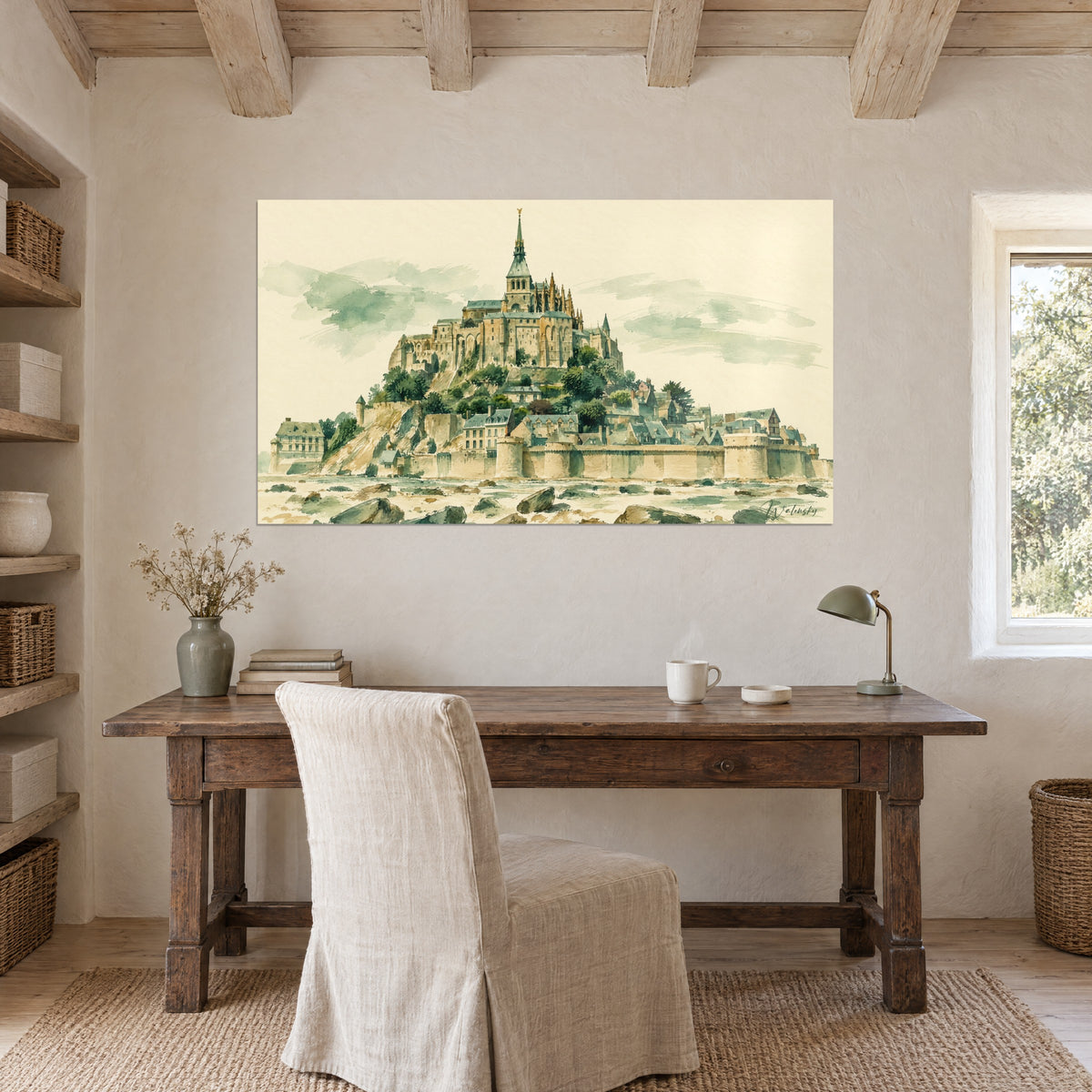 Wall art silhouette of Mont-Saint-Michel, sand-coloured ramparts and pale green sky, above a raw wood desk and lamp