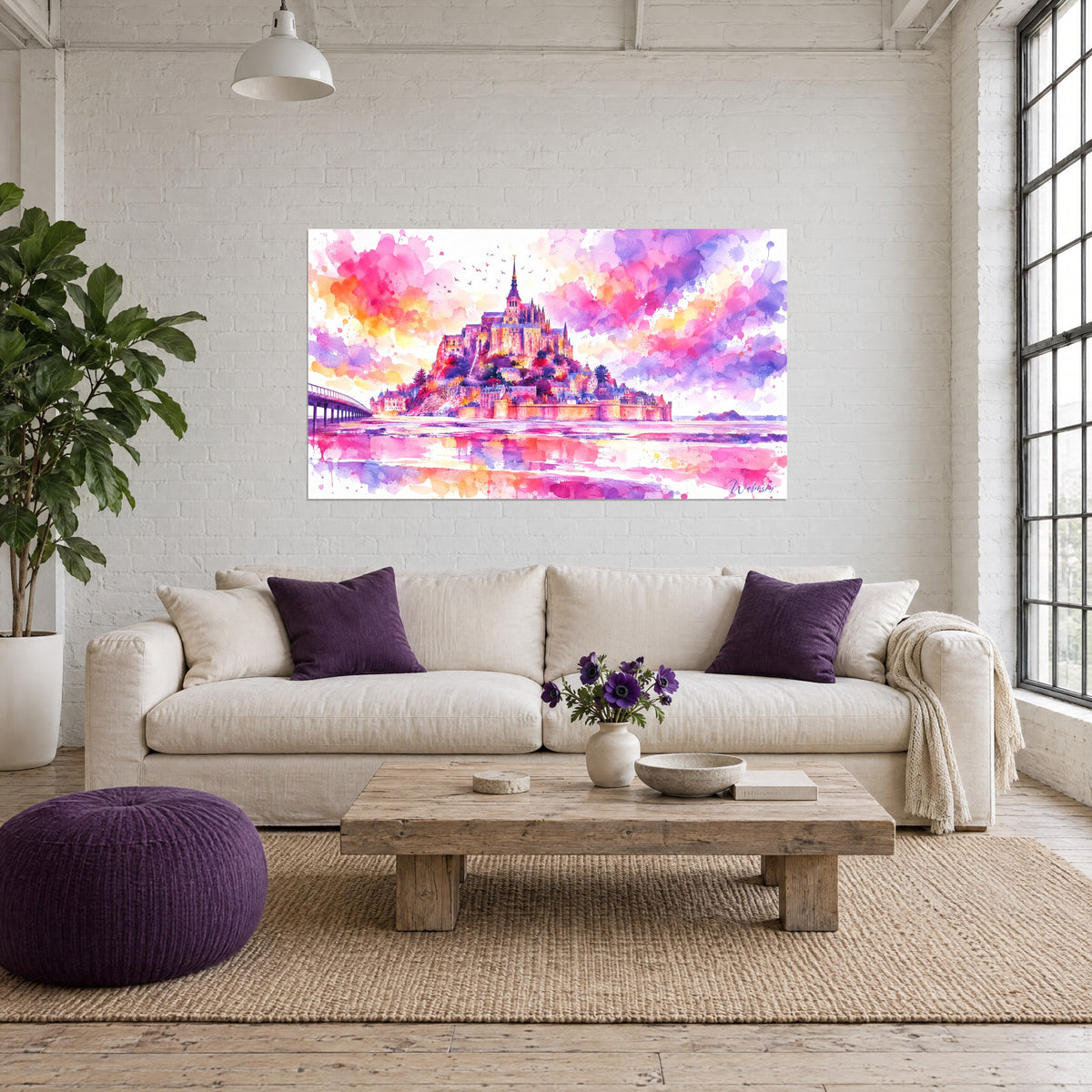 Wall art abbey in pink and violet watercolor against an orange sky, reflections on the bay, above a sofa in a bright living room