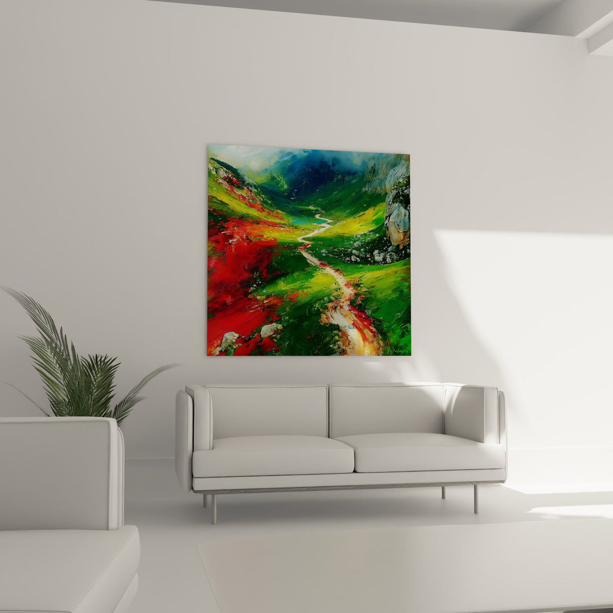 Vallée peinte en vert émeraude et rouge flamboyant, tableau montagne au-dessus d'un canapé dans un salon lumineux
