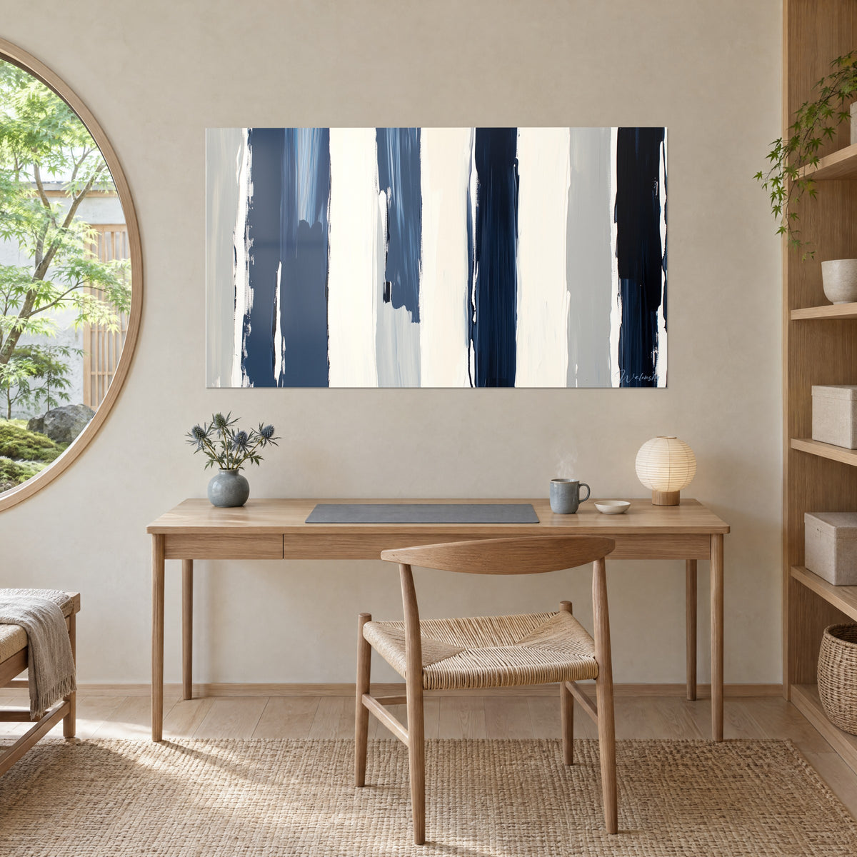 Wall art composition of vertical lines in ink and cream white, grey shades, above an oak desk and a lamp
