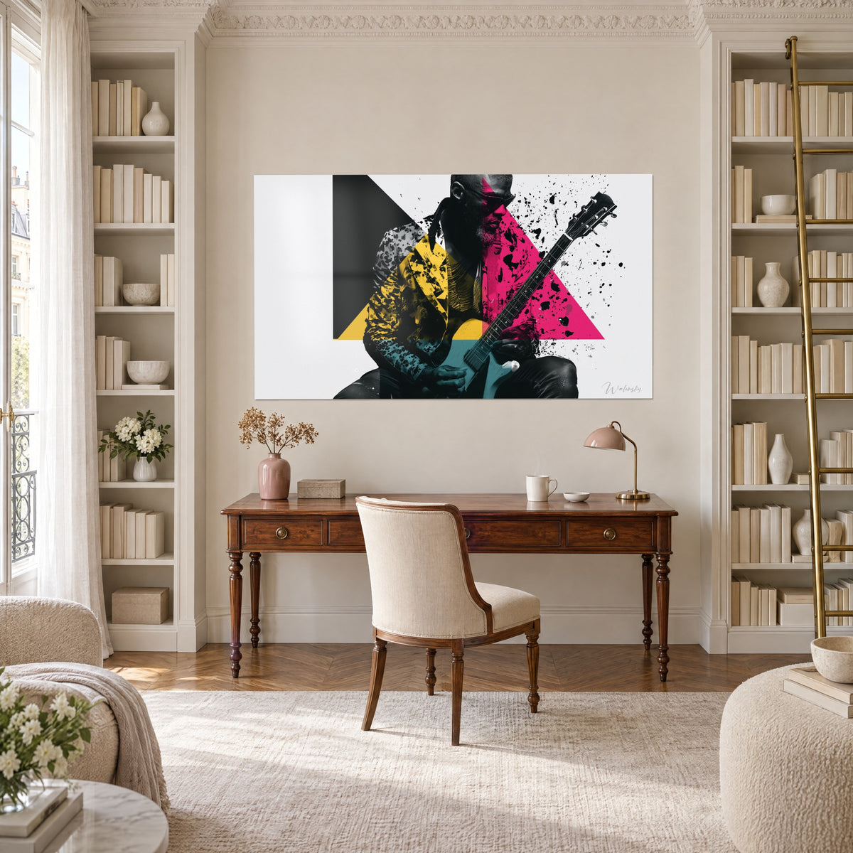 Cuadro hombre con guitarra entre un triángulo fucsia y un bloque negro, manchas de tinta, colgado en una pared de escritorio y estanterías
