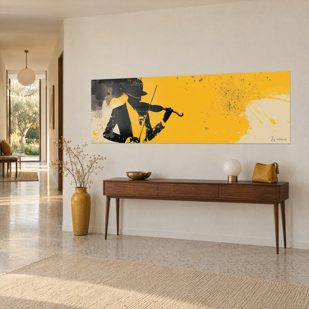 Wall art hatted musician playing violin, black ink and grey splashes on bright yellow and cream, three-quarter view on a hallway wall