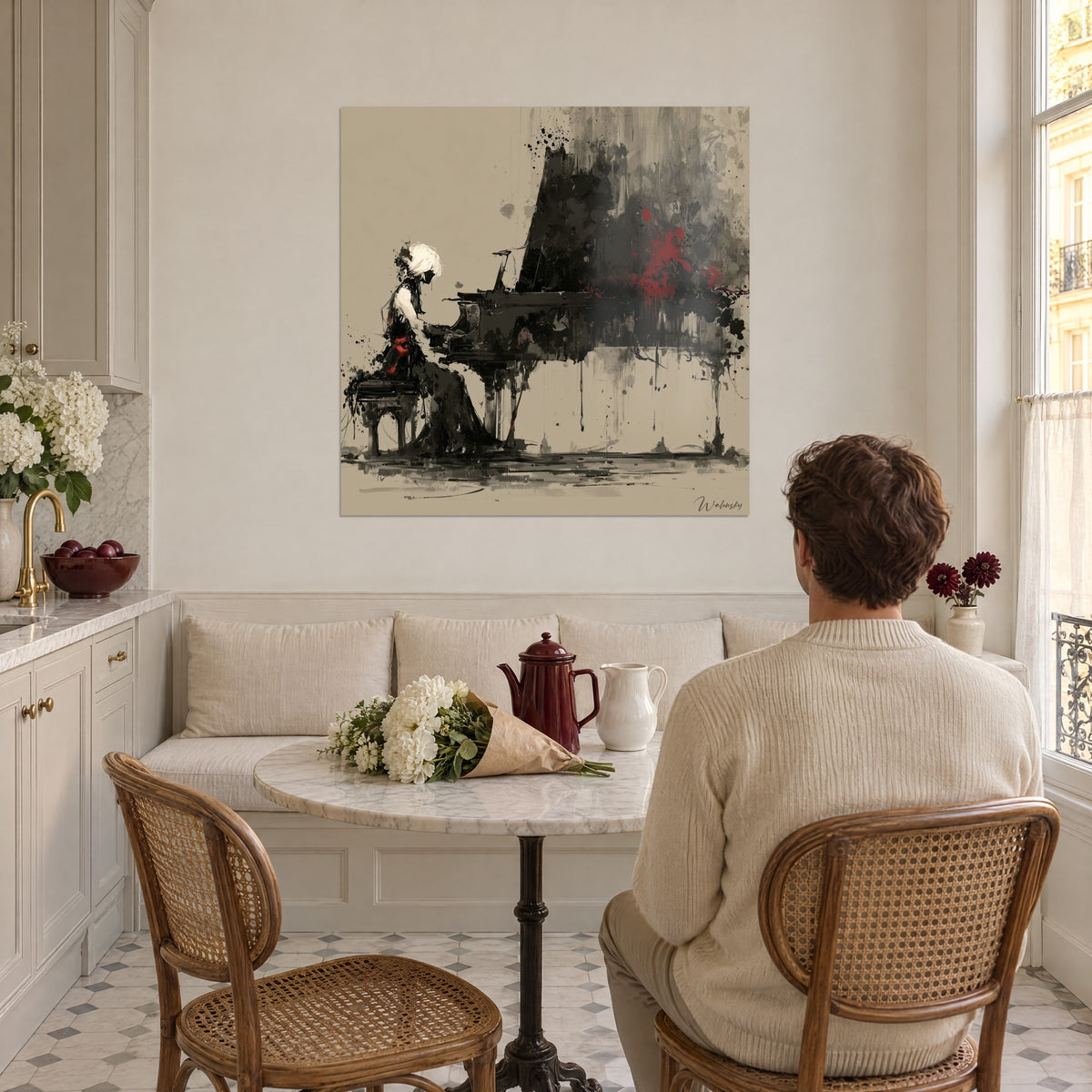 Wall art young white and black woman playing piano, grey streaks and bright red, facing a round marble table in a light kitchen