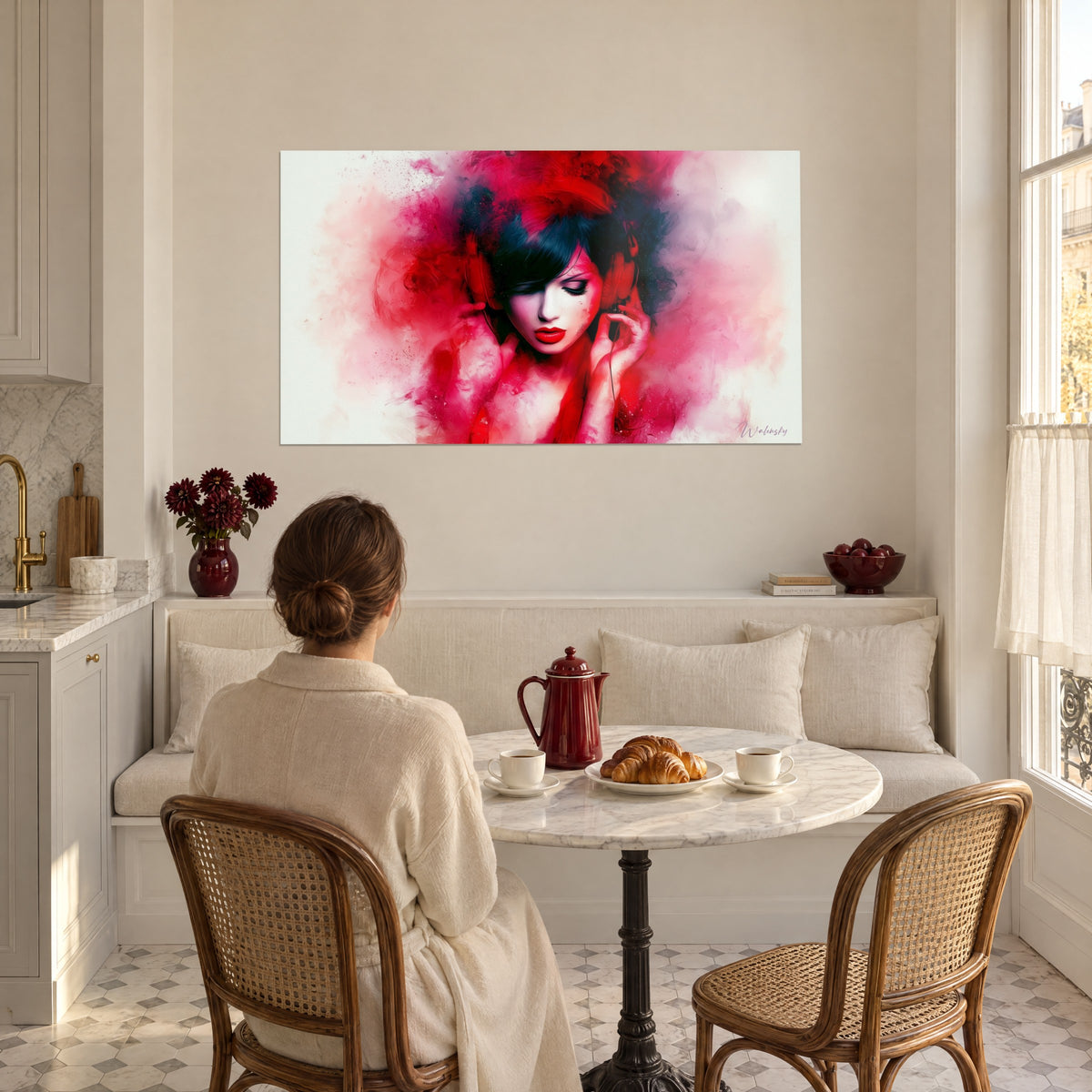 Wall art of a muse in vermilion headphones, lowered eyelids, clouds of pink and black paint, facing an ivory banquette in a dining nook