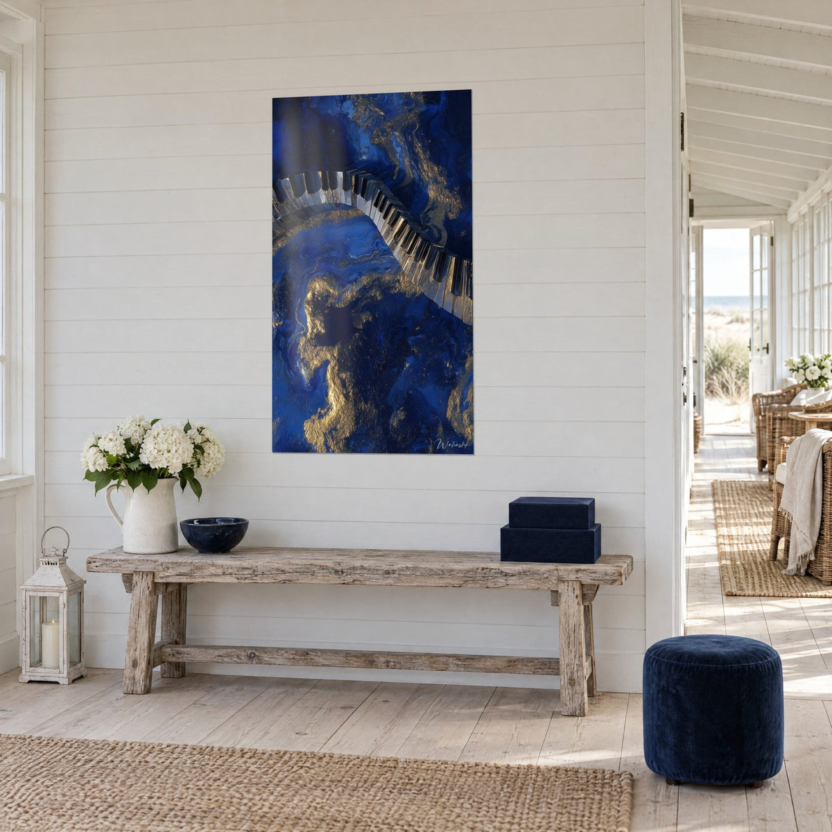 Wall art ribbon of black and ivory keys undulating over sapphire marble veined with gold, beside a raw wood console