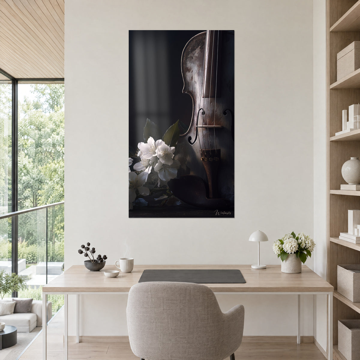 Wall art of a musical motif in brown and black shades, fine strings, white blossoms and olive leaves, hung behind a desk and a plant
