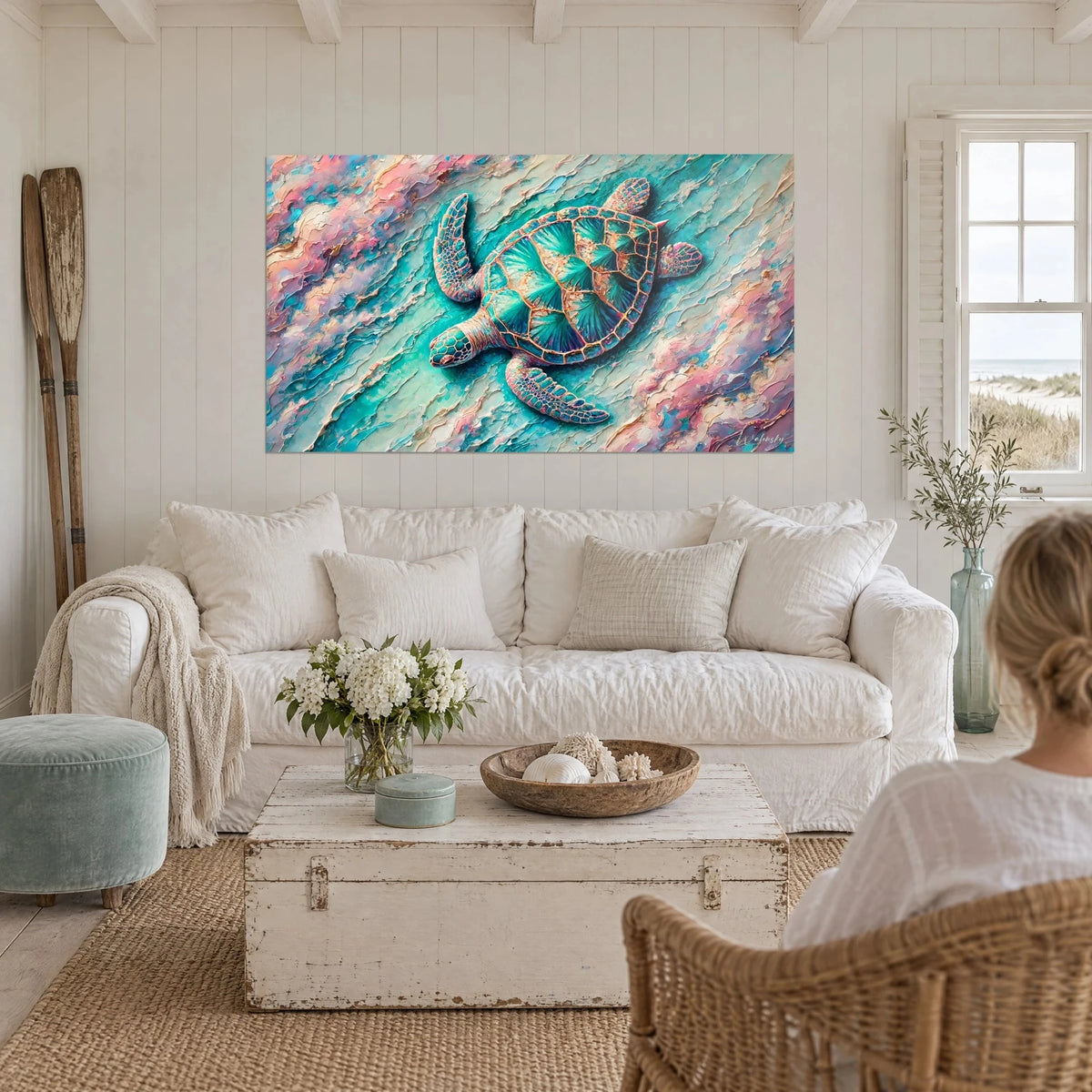 Wall art turquoise sea turtle swimming over pastel pink waves, shell with golden highlights, above a sofa in a bright living room