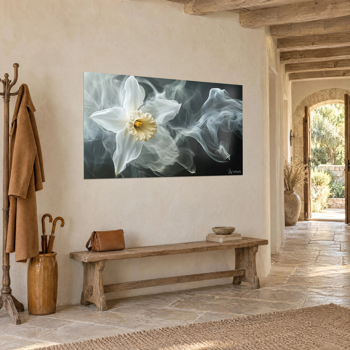 Wall art flower with ivory petals and a cream frill, grey swirls of smoke on a black background, whitewashed wall and wooden bench in a stone hallway