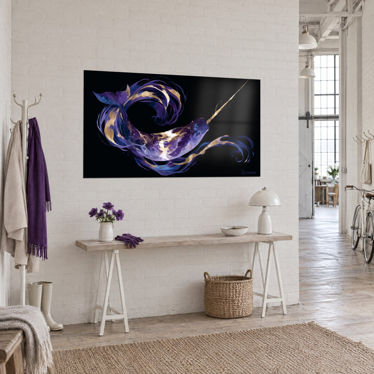 Wall art Arctic whale in a purple and gold spiral, fin ribbons on black background, white brick wall of the loft