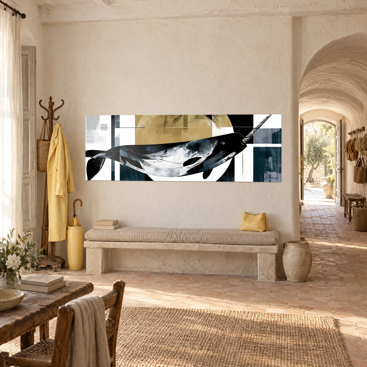 Wall art Arctic whale in black ink and flaking white, ochre sun behind, hung above a stone bench at the farmhouse