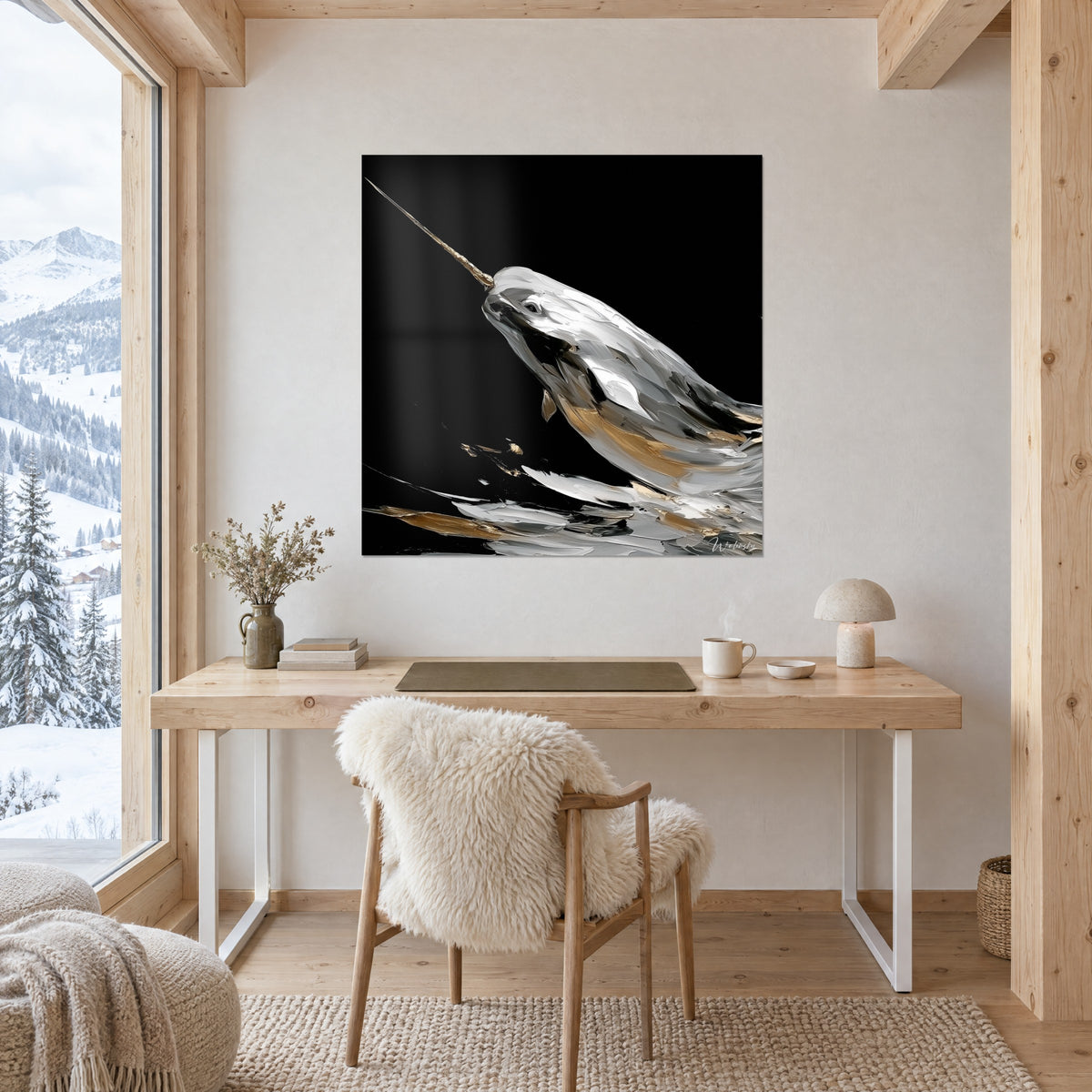 Quadro di un mammifero marino con lunga zanna dorata, materia madreperlacea bianca e nera, appeso sopra una scrivania di legno chiaro