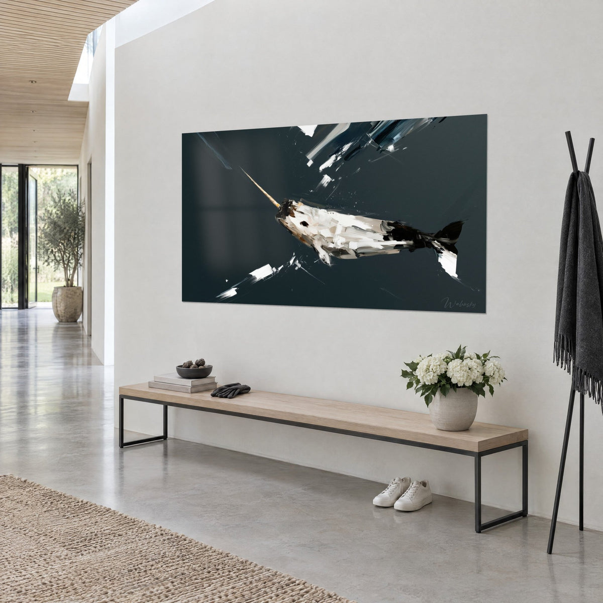 Wall art arctic whale in cream and black, long amber tusk, white impasto highlights, light wall, wooden console