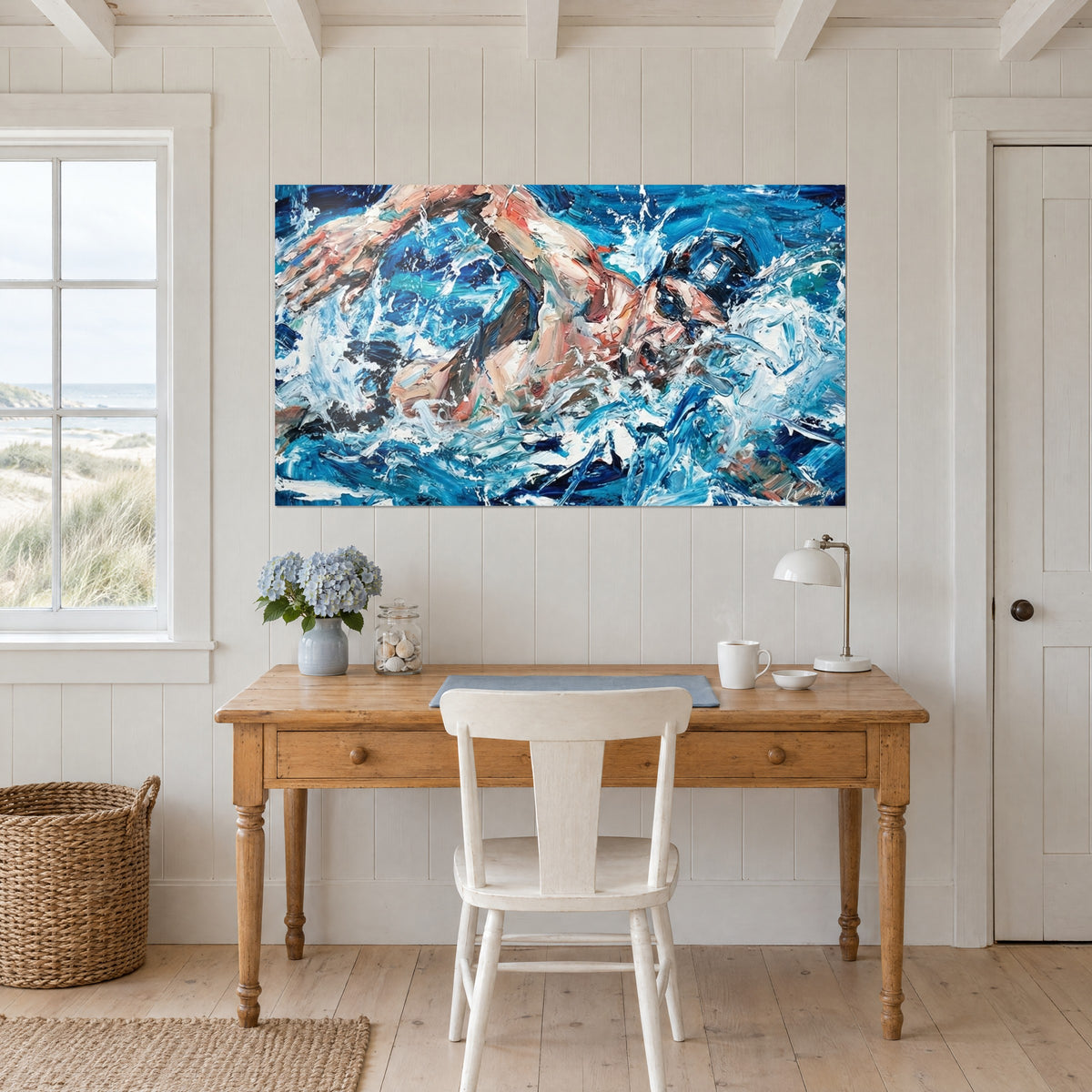 Quadro di uno sportivo acquatico in movimento, pelle rosea, occhiali neri e onde azzurre, appeso sopra una scrivania in legno